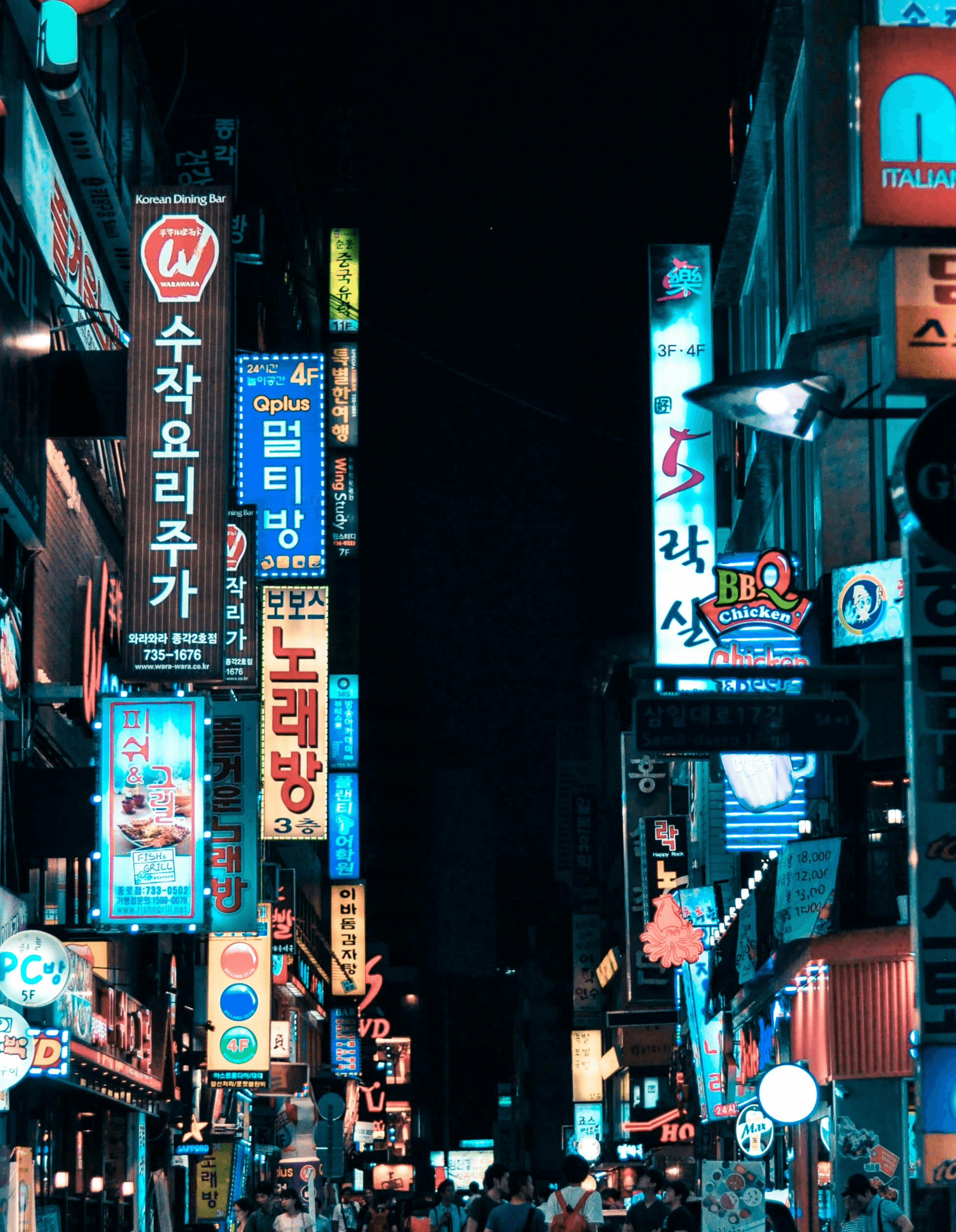buildings with pathway surround by people