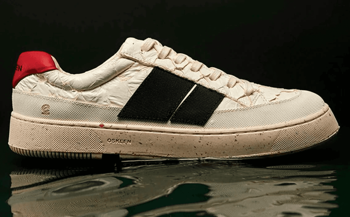 person writing on a piece of paper 