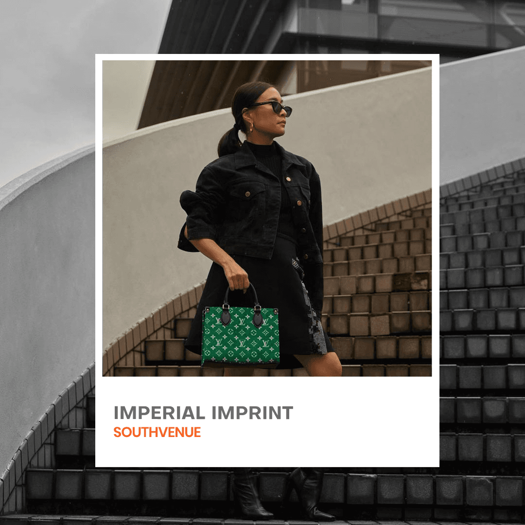 Street style model carrying luxury handbag