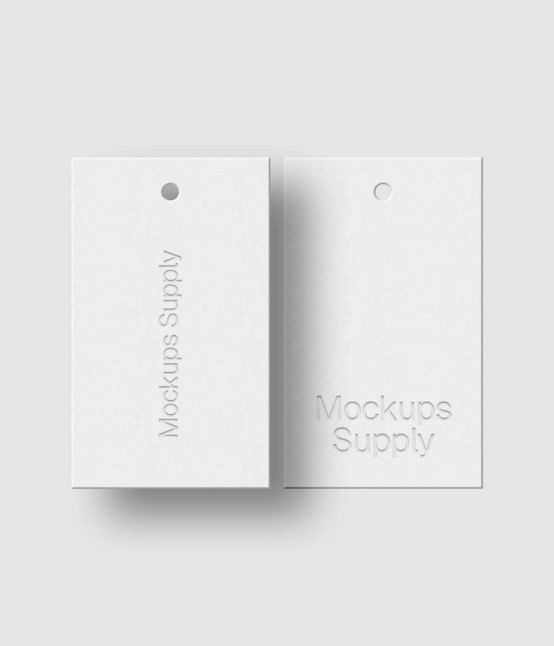 Two white 3x5 hang tags mockup on white background with soft shadow and debossed logo effect for Photoshop download psd