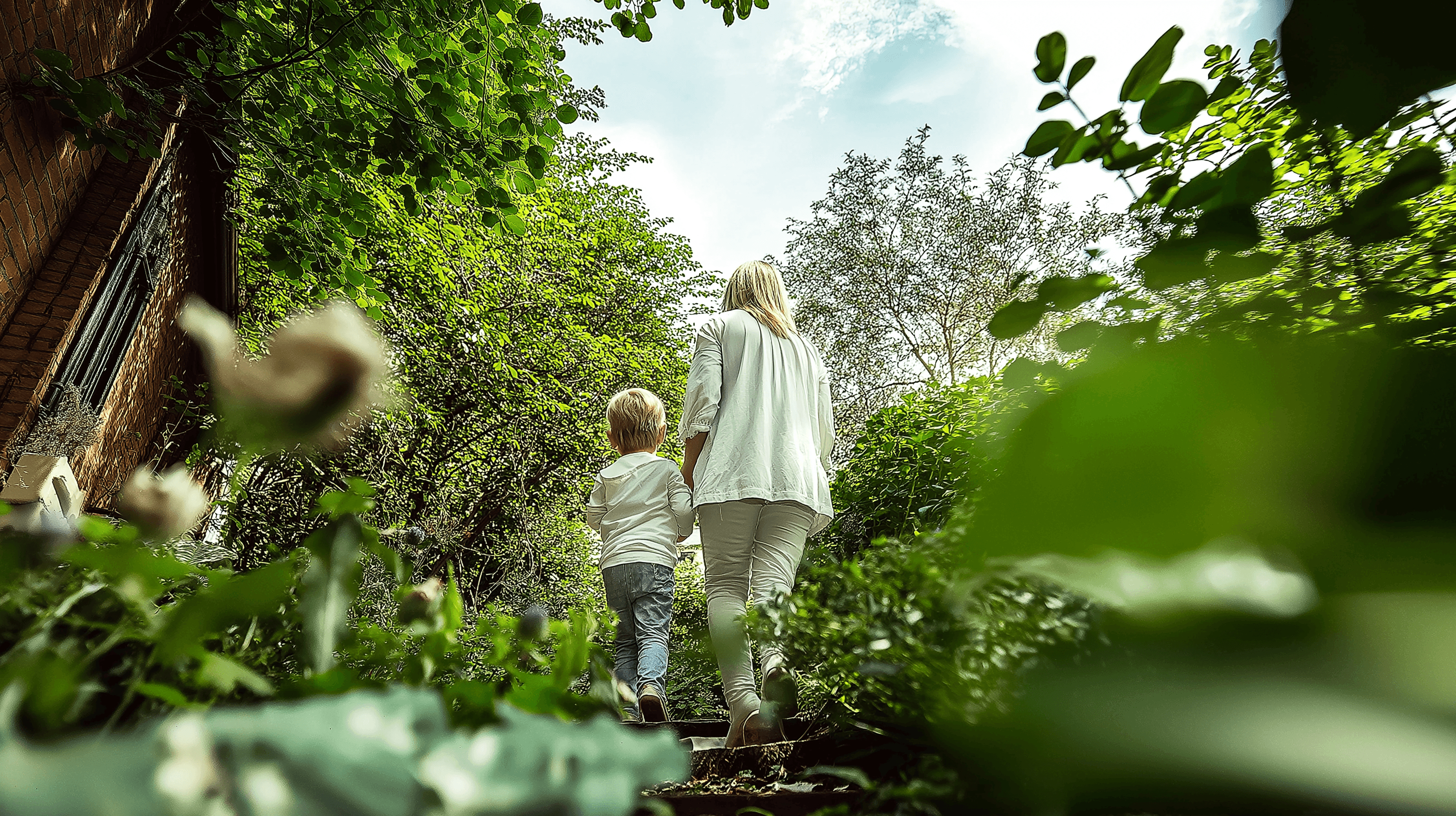 enjoying an outdoor hike through autumn leaves, smiling and chatting together.