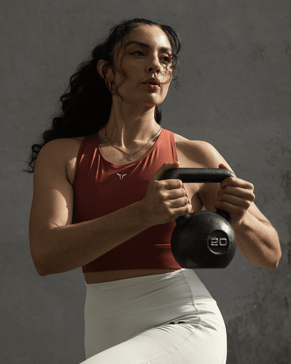 a group of people in a gym doing squat exercises