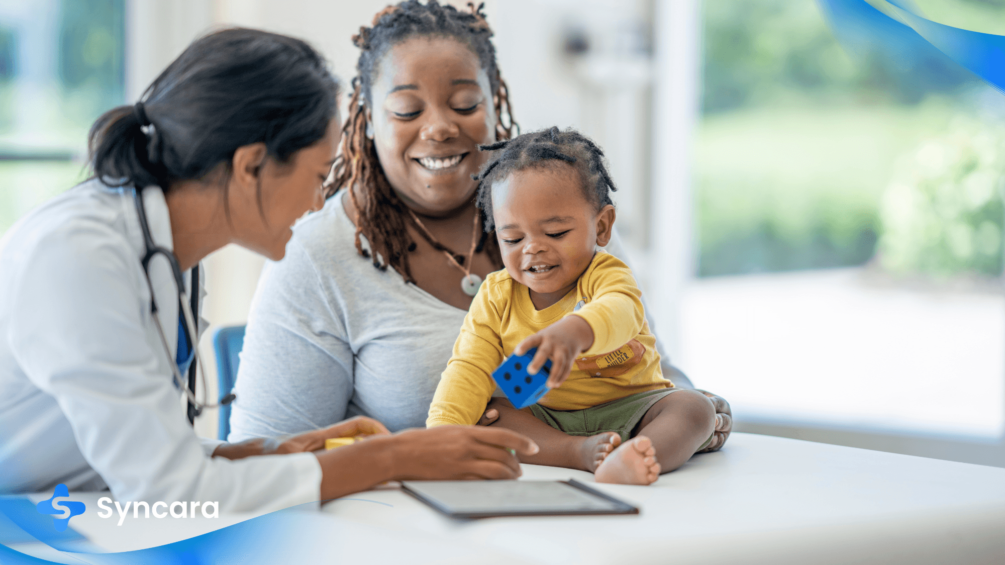 Family doctor consulting with a mother and baby during a check-up in Canada.