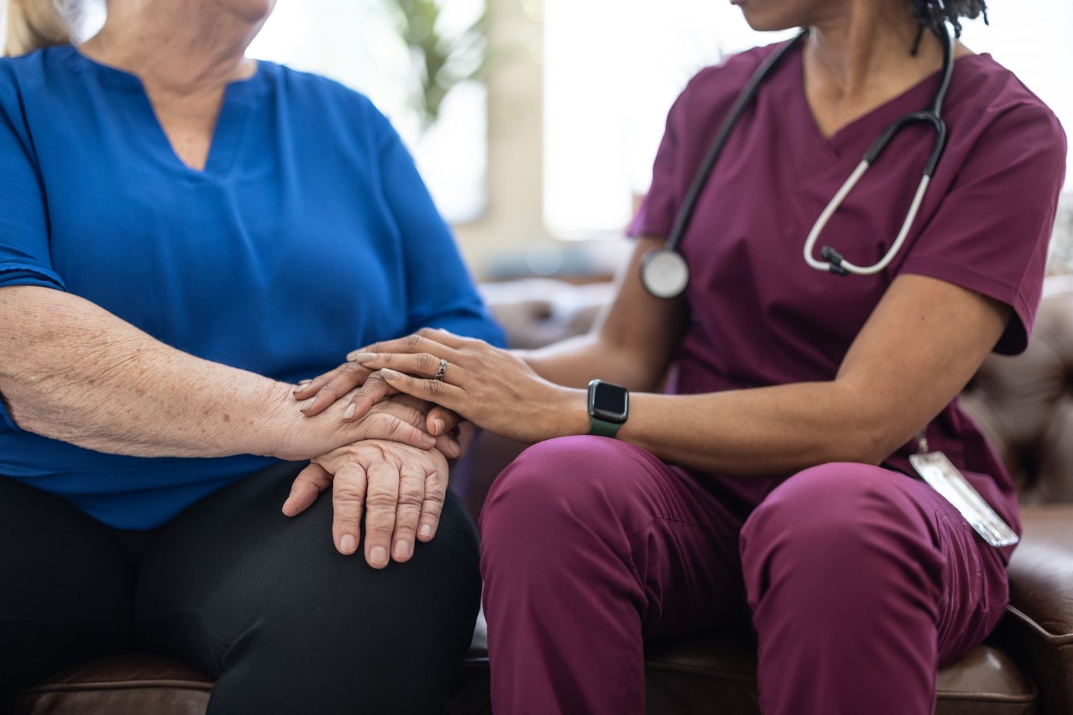 Healthcare provider comforting a patient