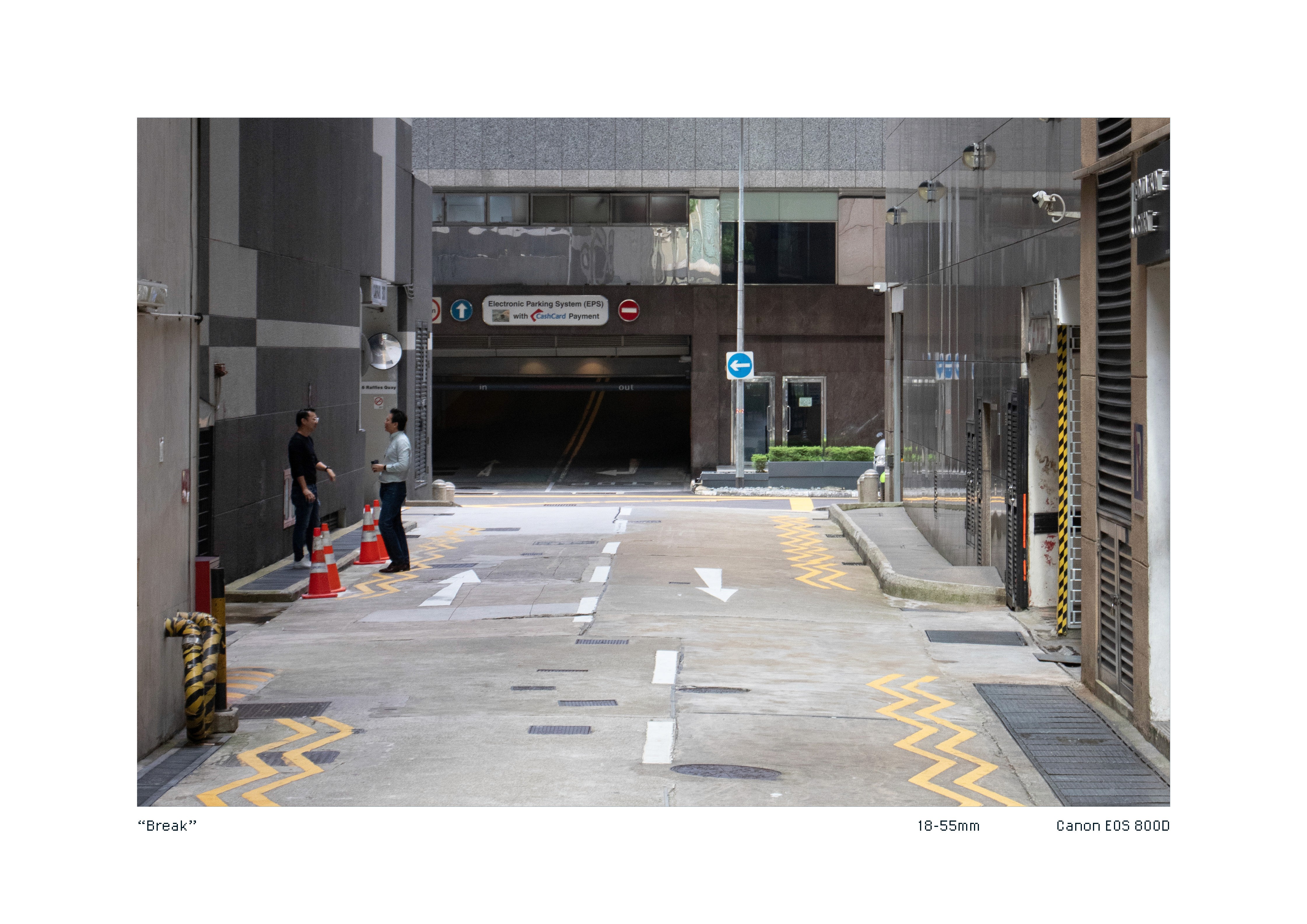 Two people conversing in a quiet back alley of town