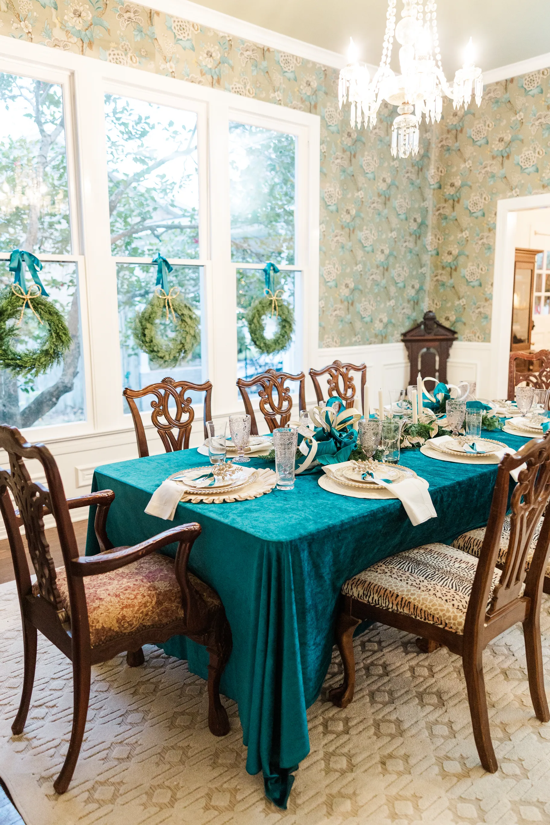Luxury table setting by Sarah Overall Events with pink embroidered napkins, gold-rimmed plates, floral arrangements, and personalized menus in Shreveport.