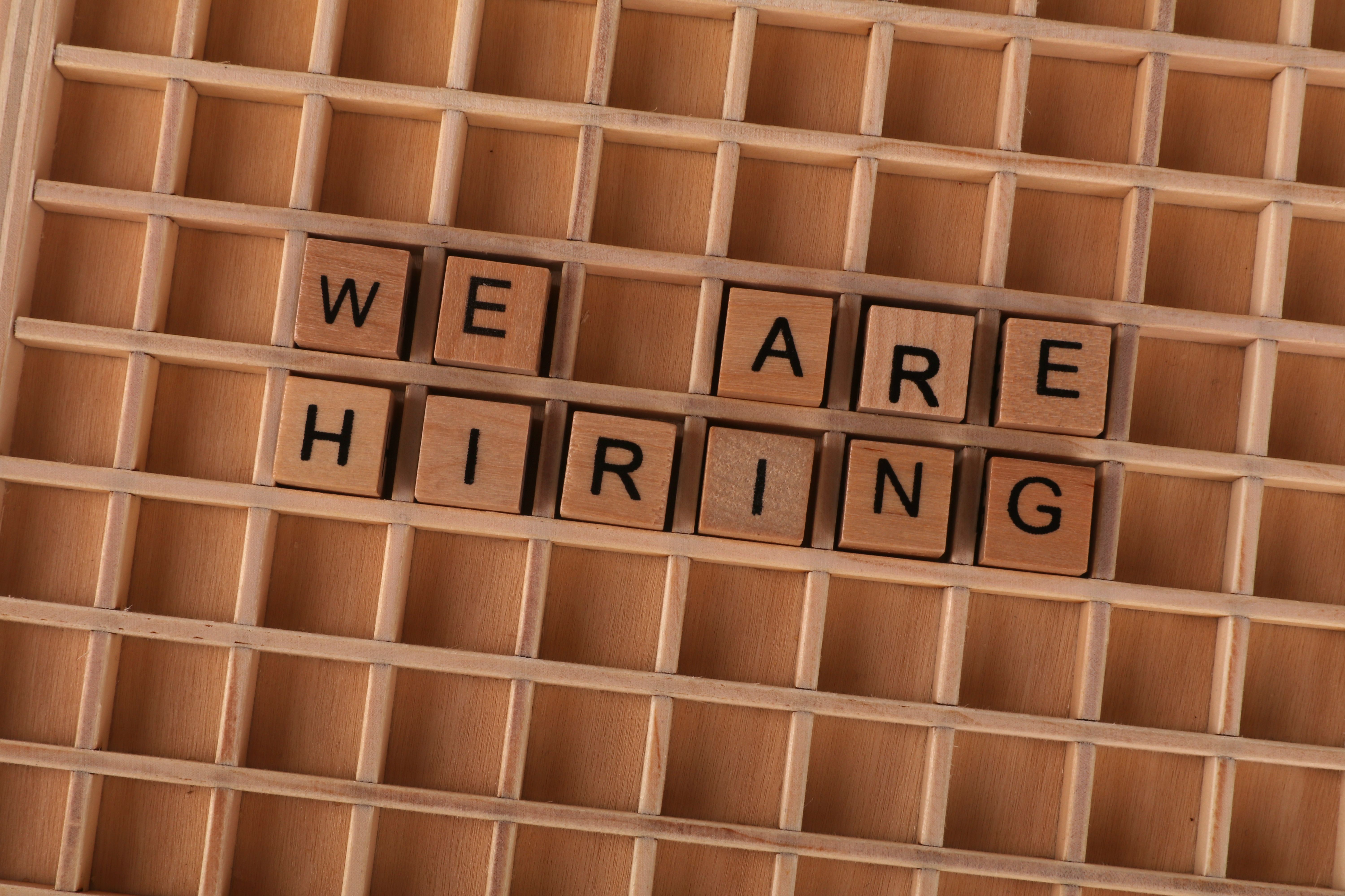 wooden-tiles-on-a-board-forming-the-phrase-'we-are-hiring',-ideal-for-job-announ - ann-h (pexels)