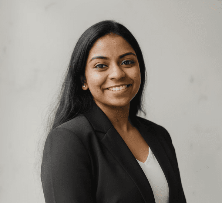 Portrait of a person in dark clothing speaking on a phone