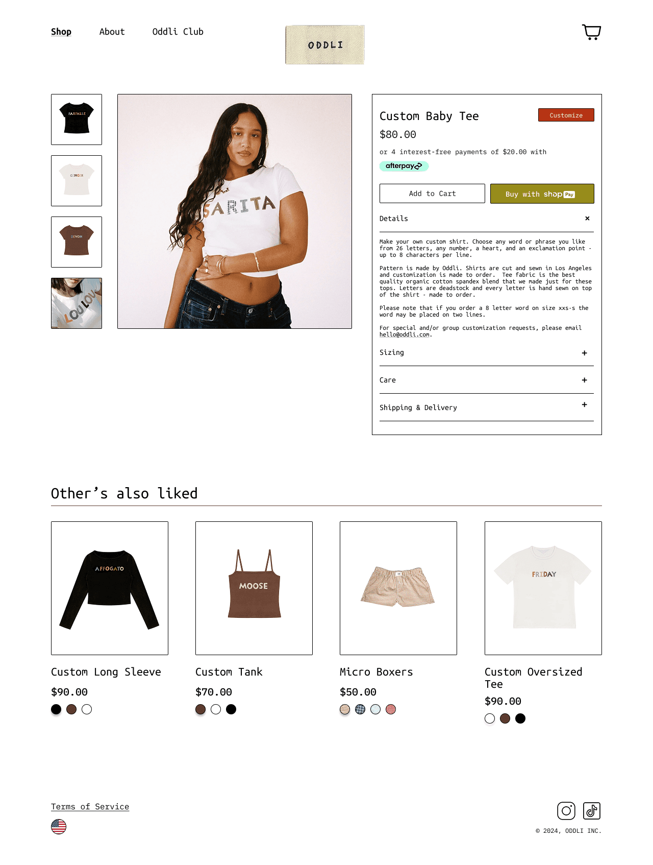 Redesigned poduct page for Custom Baby Tee showing model in white graphic tee, thumbnail gallery, price, payment options, and related products