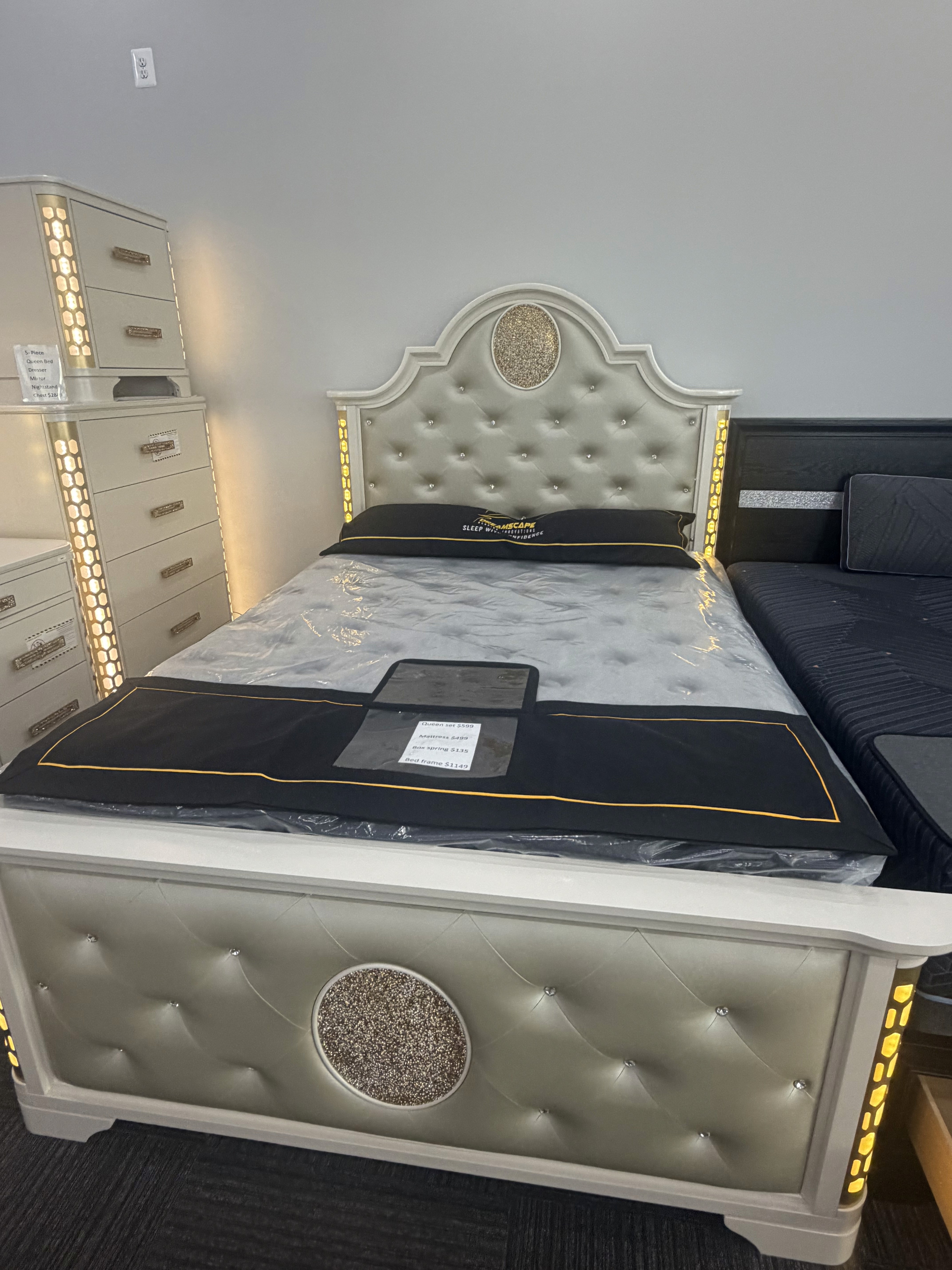 White lighted bed with mattress in the showroom