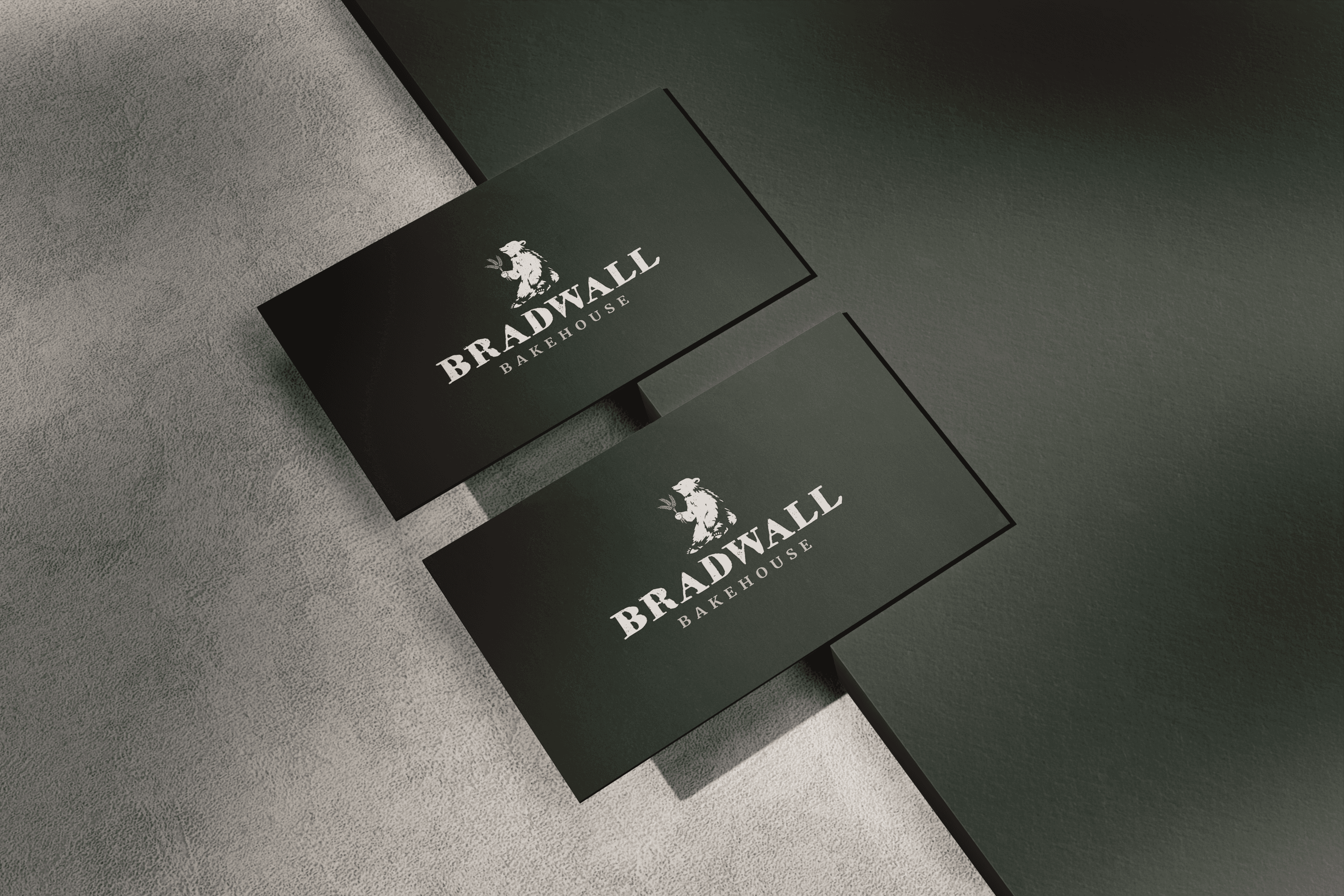 a pair of cell phones on a concrete block