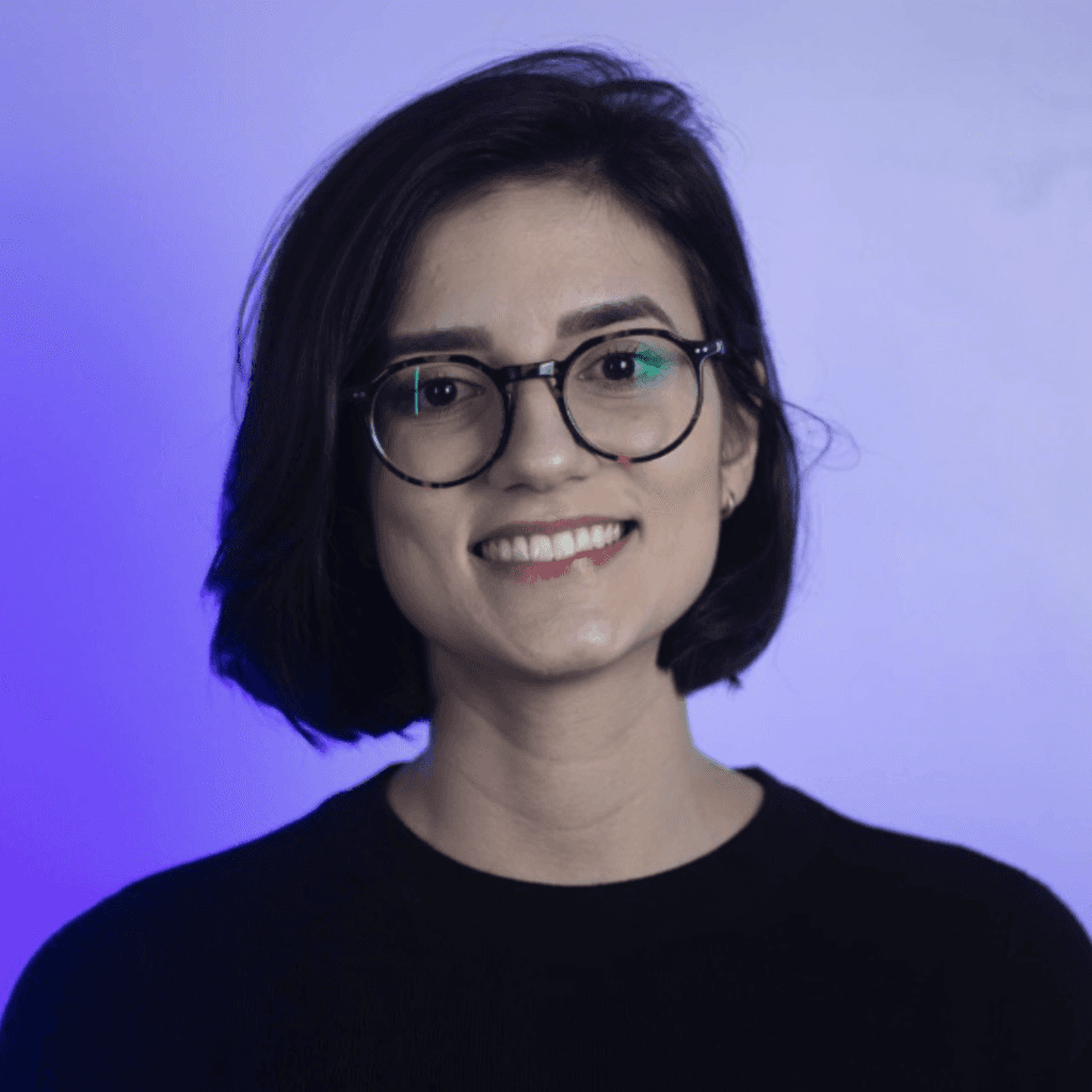 smiling man with green mountaineering bag during daytime
