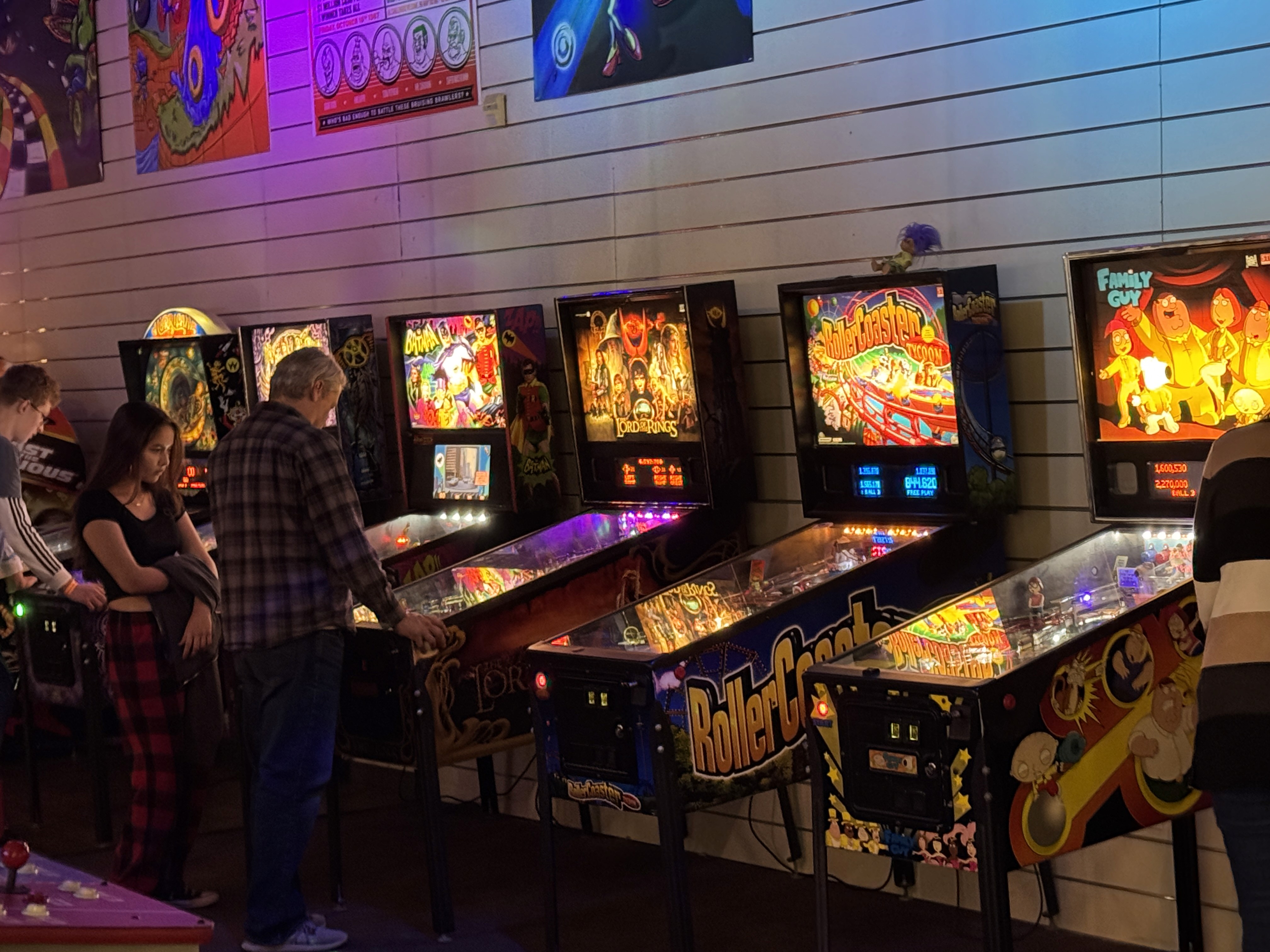 Group playing pinball in Rochester MN
