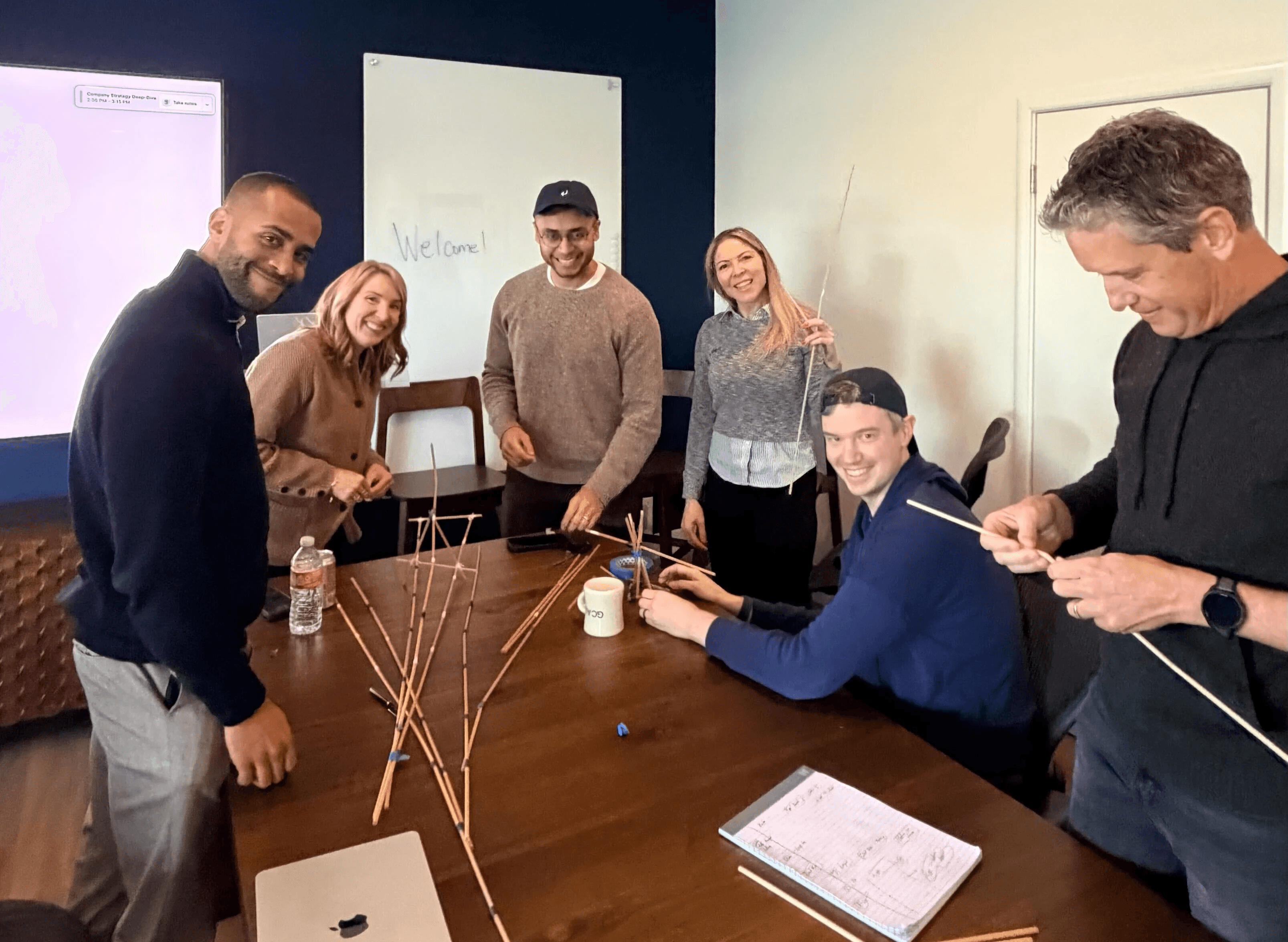 GC AI employees in a team-building tower construction game