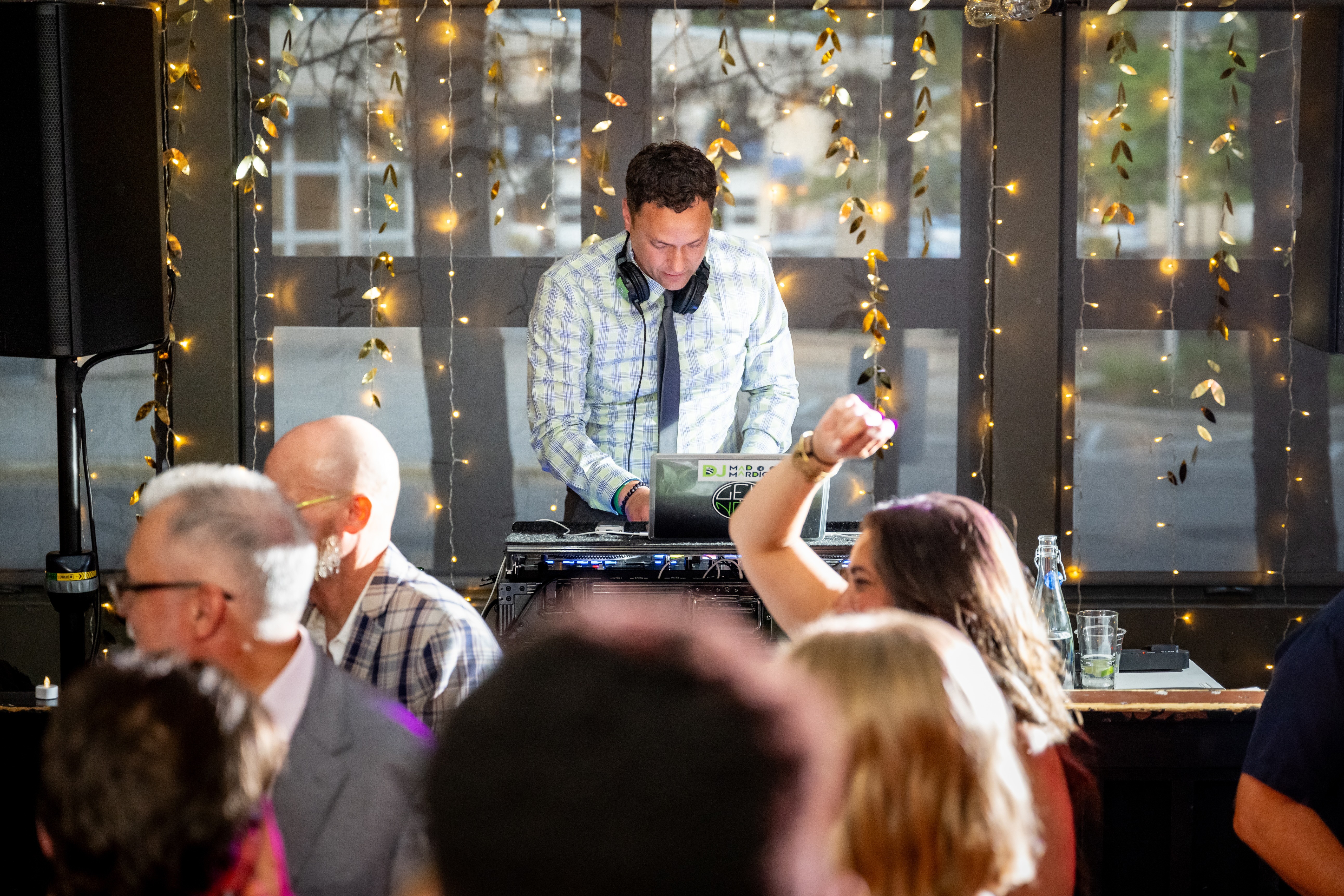 a DJ in the event space at degidios