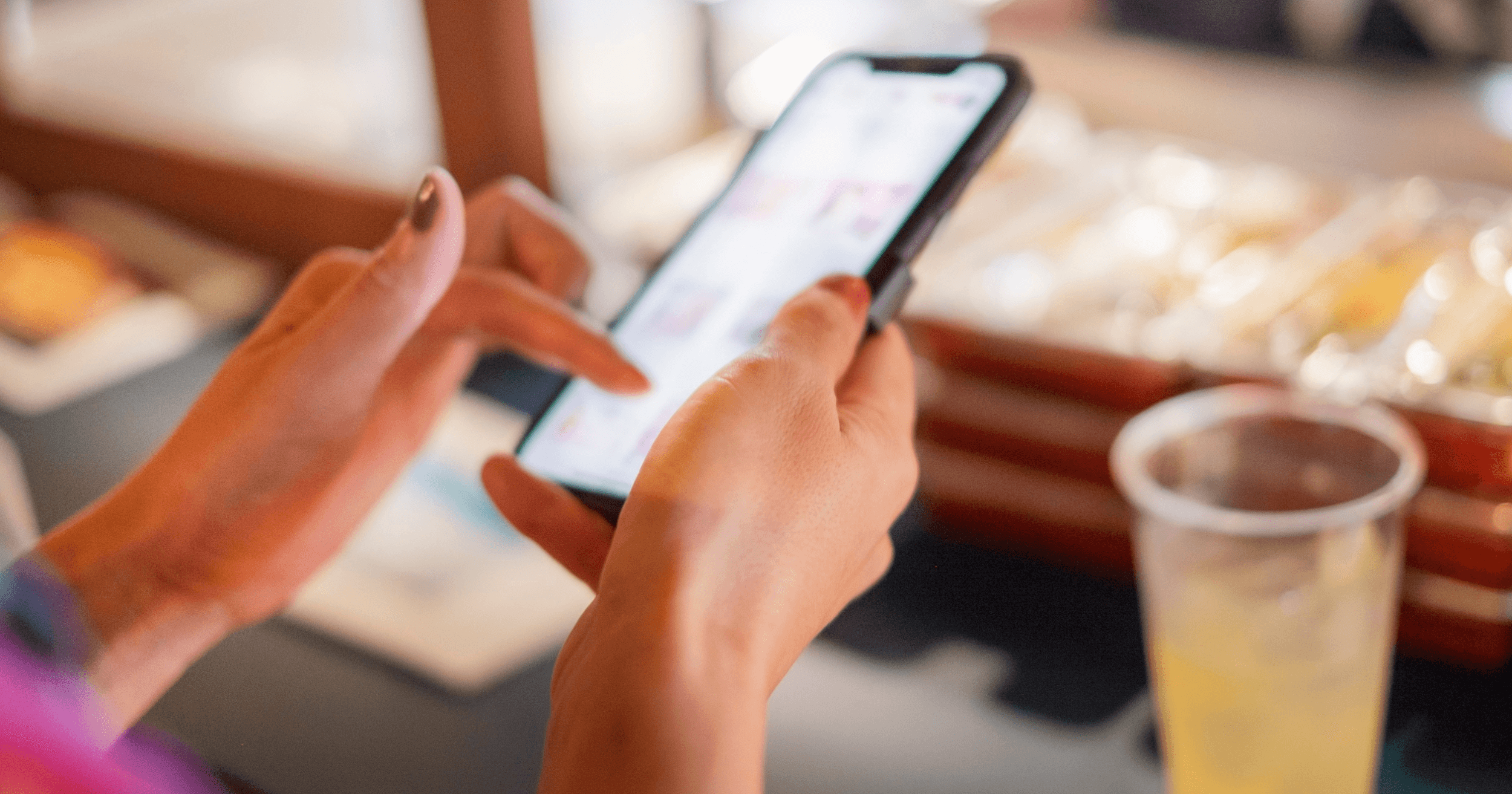 A Malaysian customer scrolling on her phone