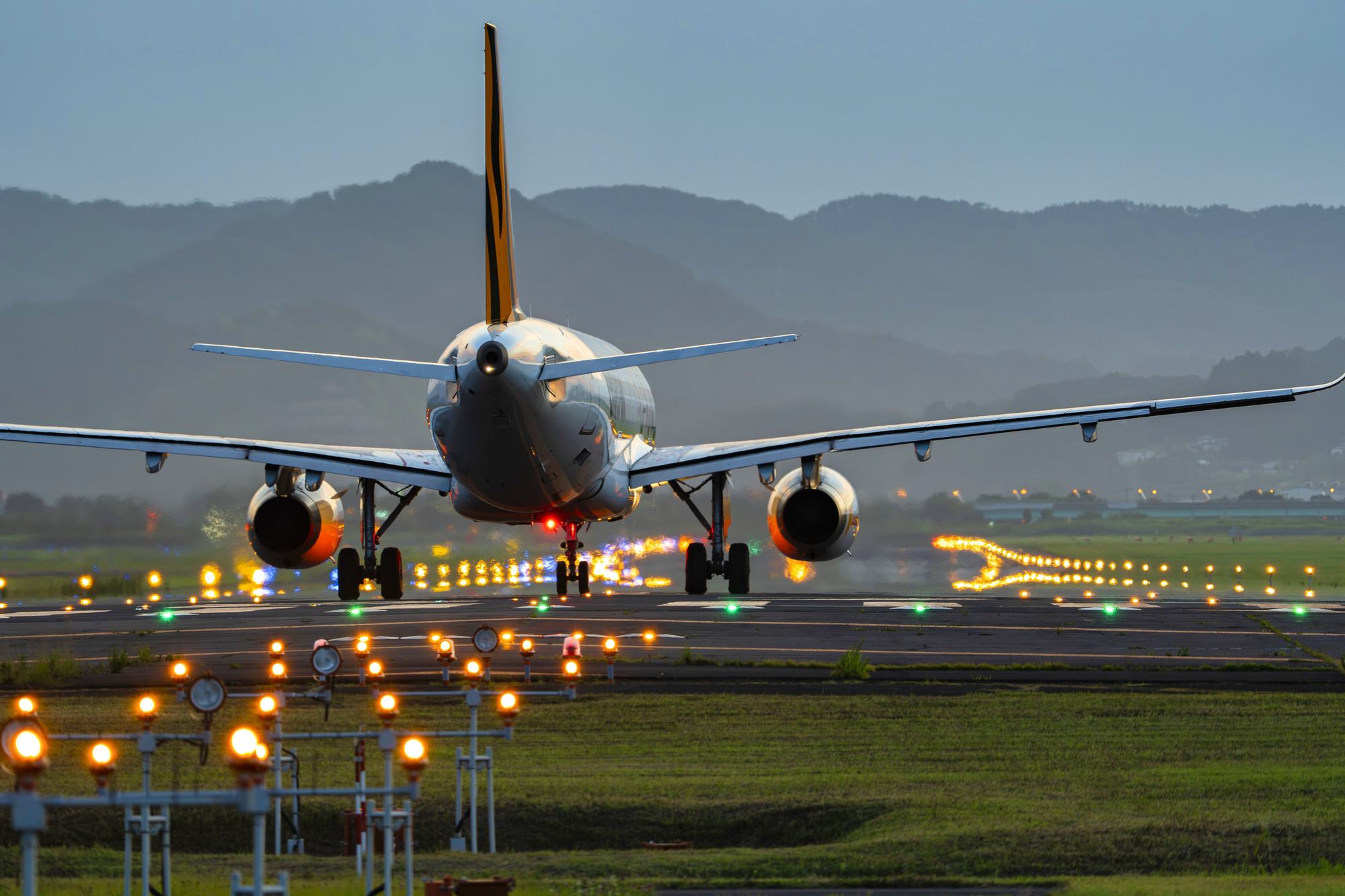 brown wooden beach lounge chair on beach during daytime