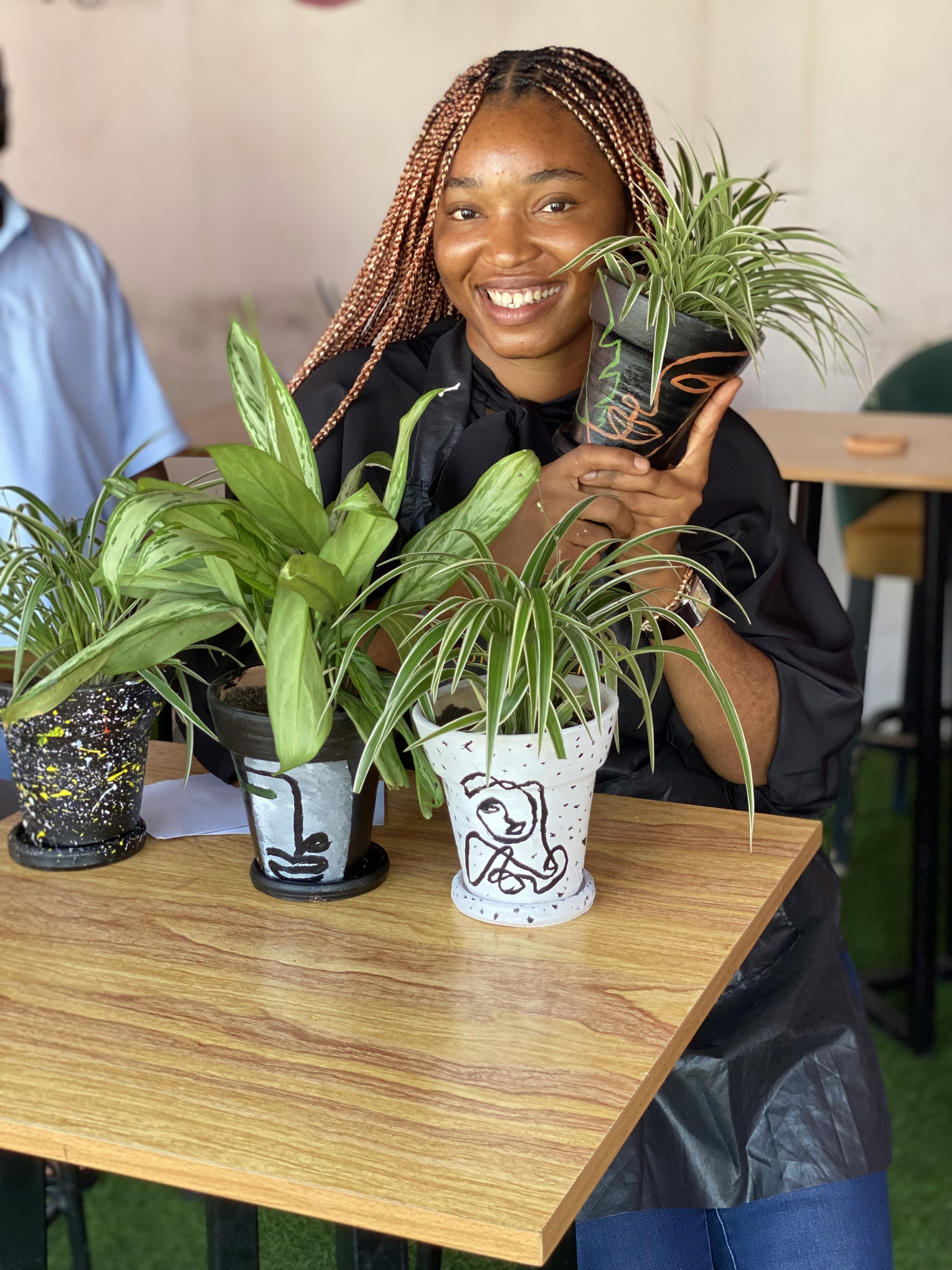 Chef Xan holding a plant vase