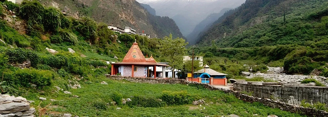 Mountain temple nestled in lush valley
