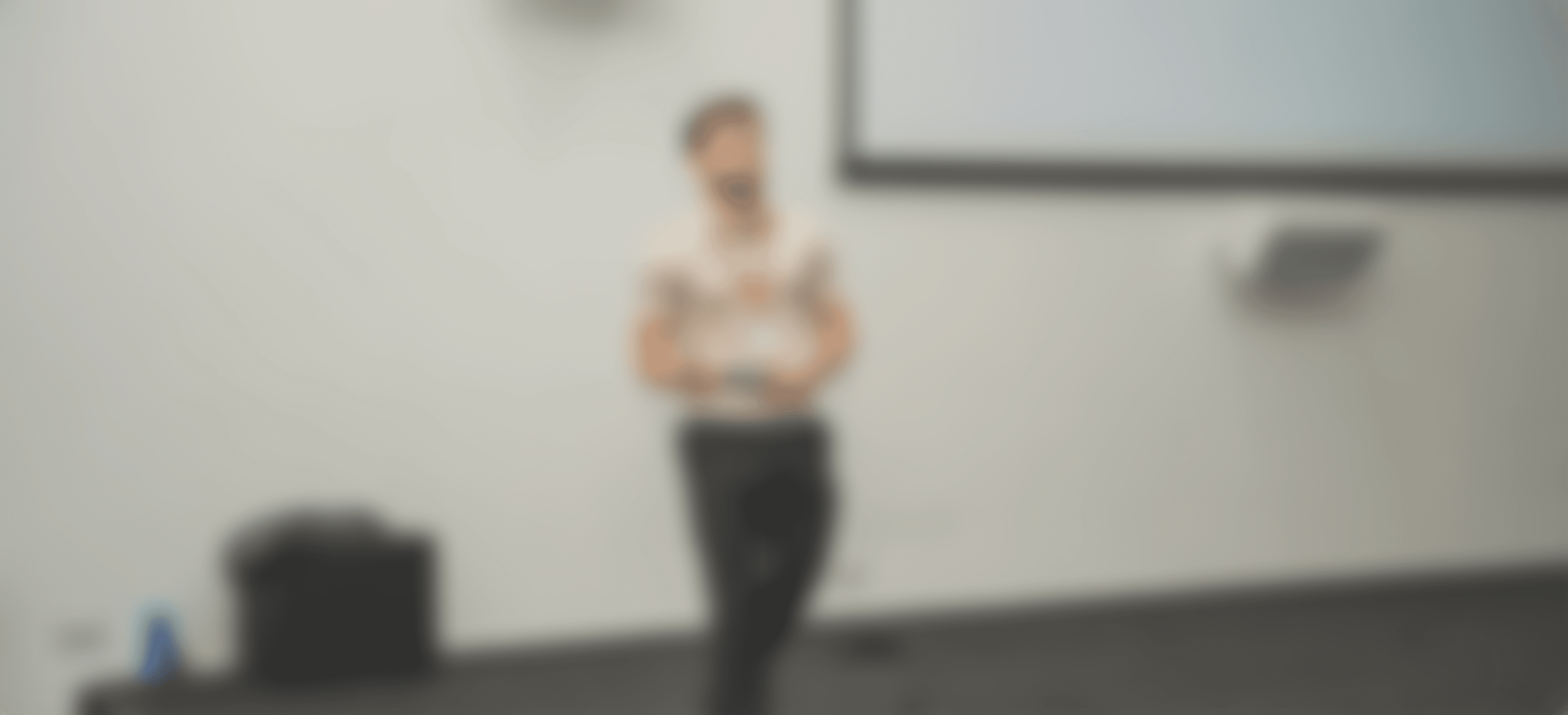 Modern spiral staircase with wooden accents and lighting