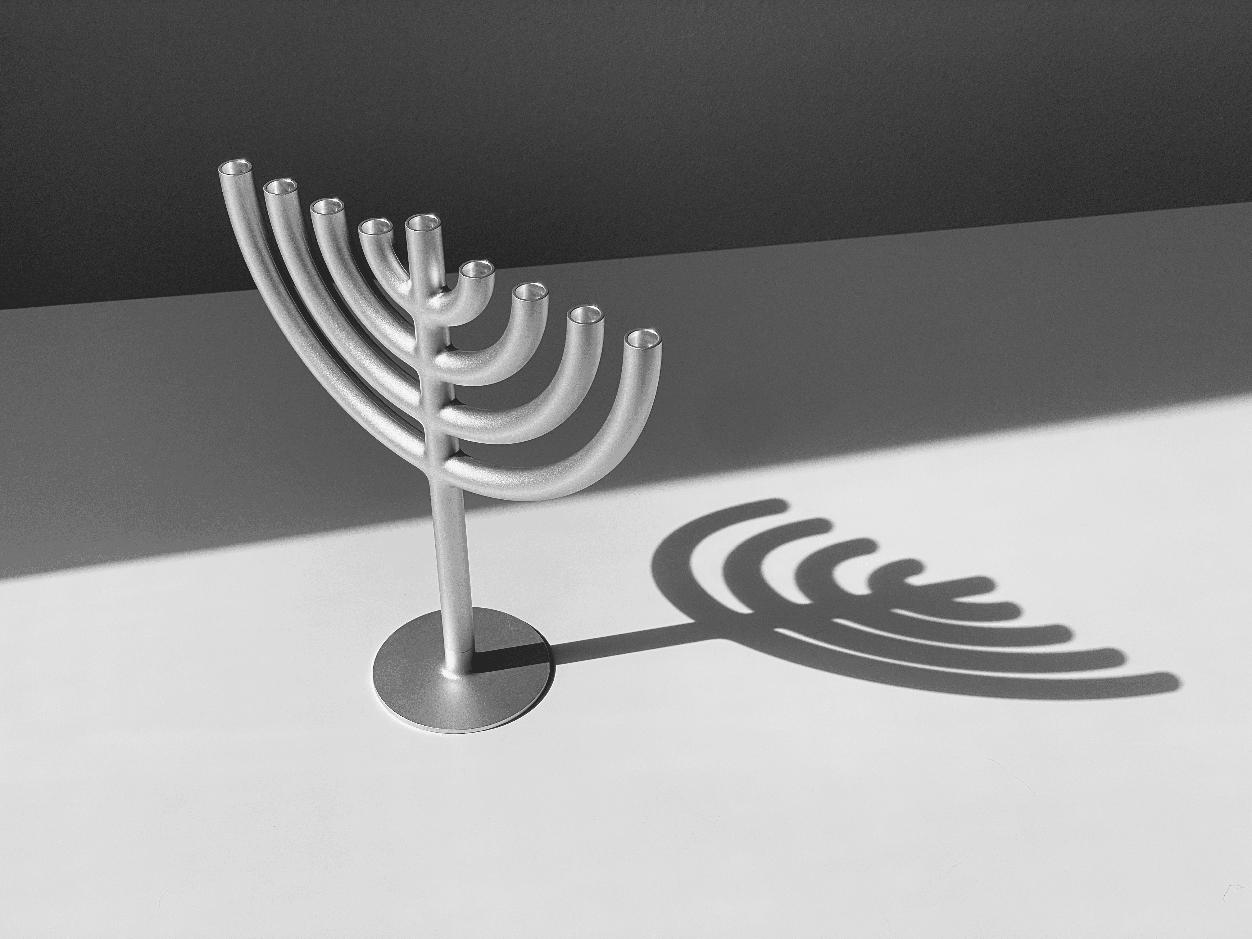 Streetside billboard with flyposters of the Batch.Works brand and illustrations