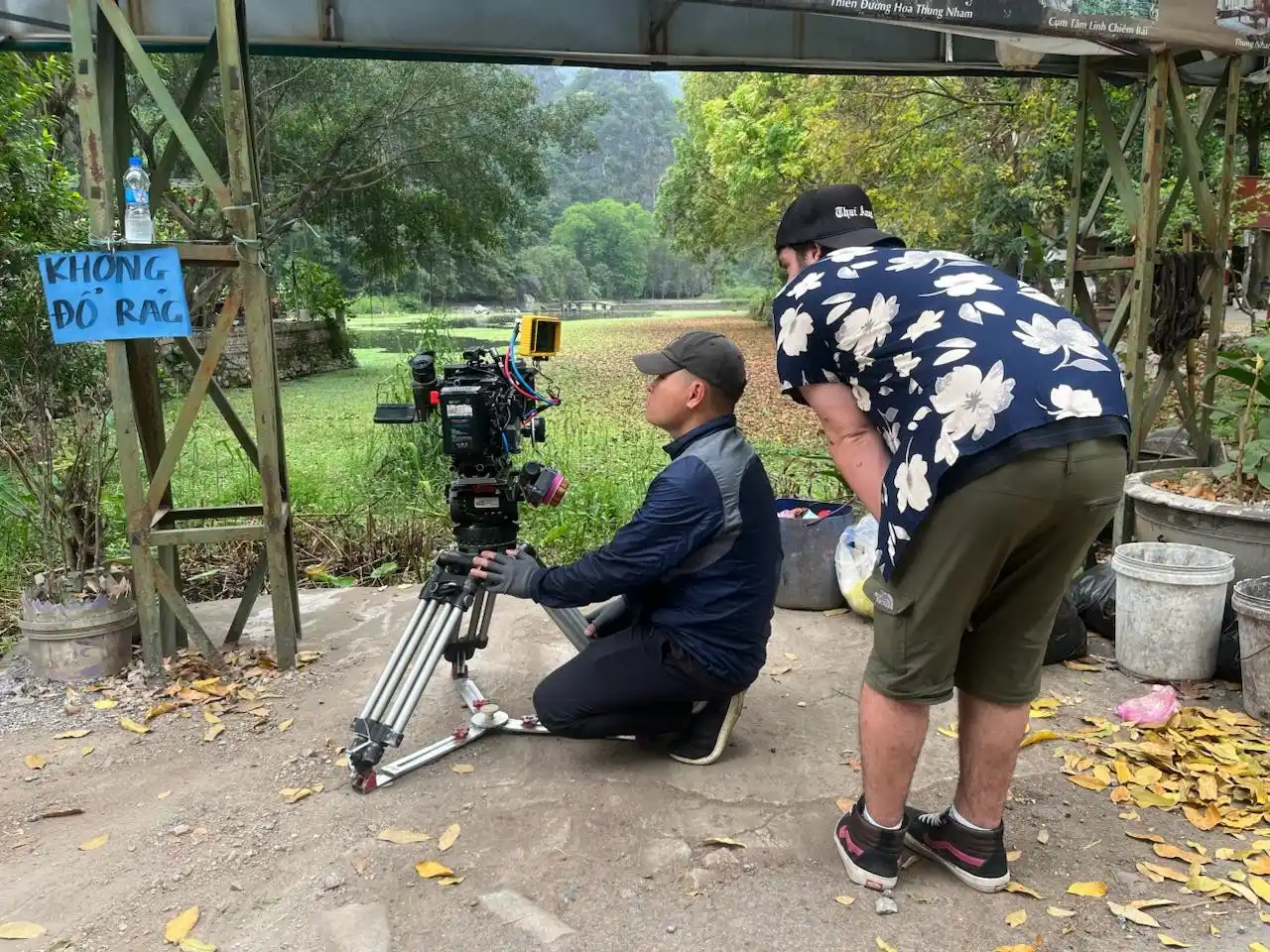 Independent film crew operating a cinema camera on location in rural Vietnam while capturing scenes for The Last Room In Hanoi.