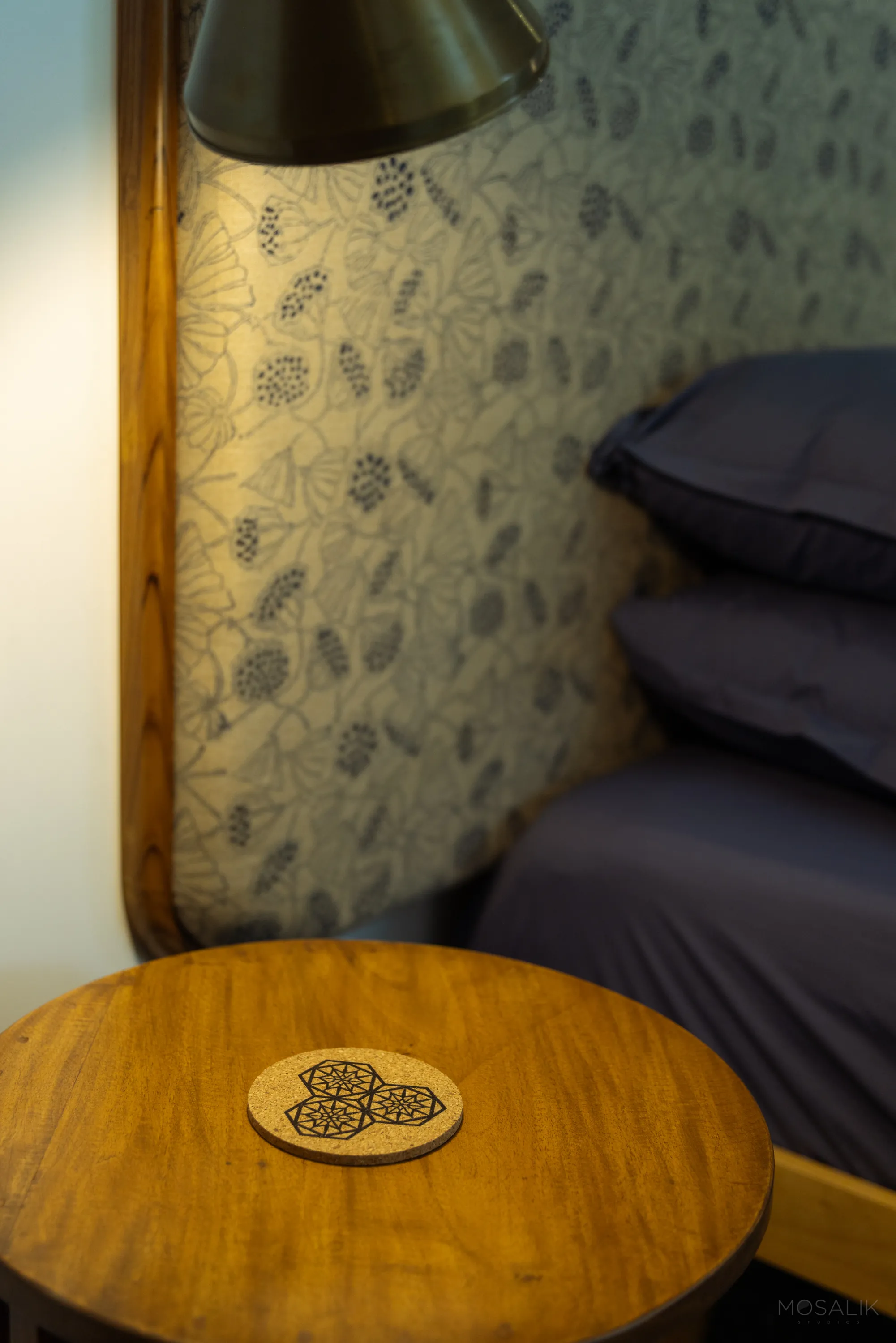 Bedside corner with block-print wallpaper at Jaali Blue