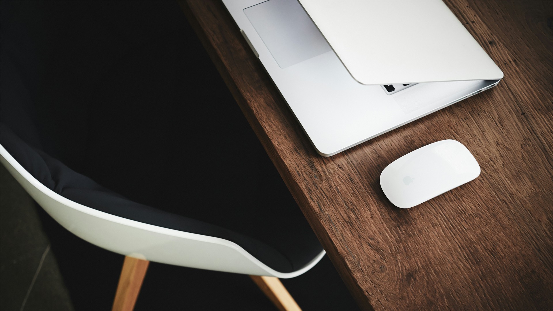 A person stands in a sandstone cave.