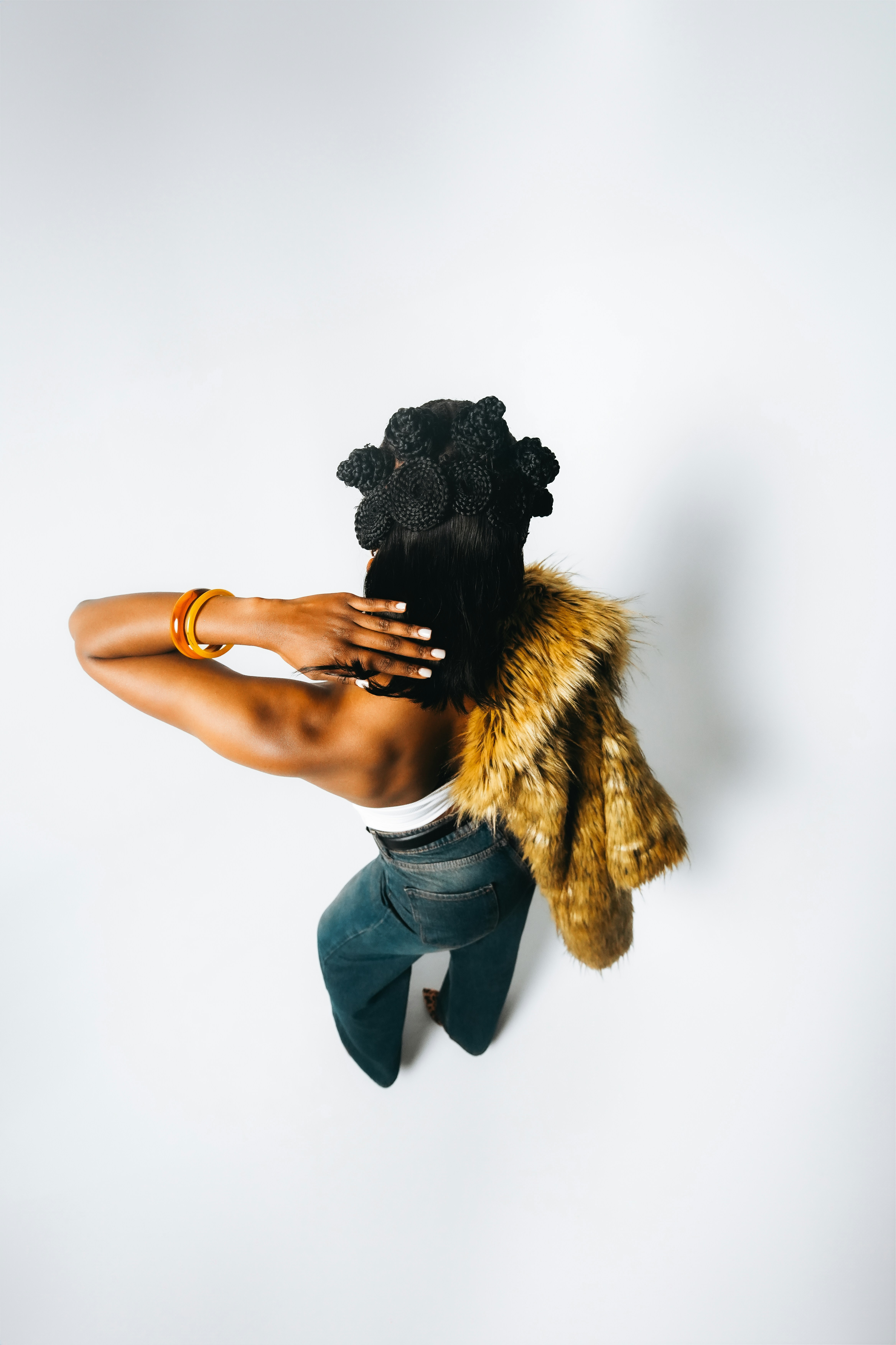 Portrait of a stylish girl with gold chain and crossed arms, bold fashion photography for Pharmapro identity