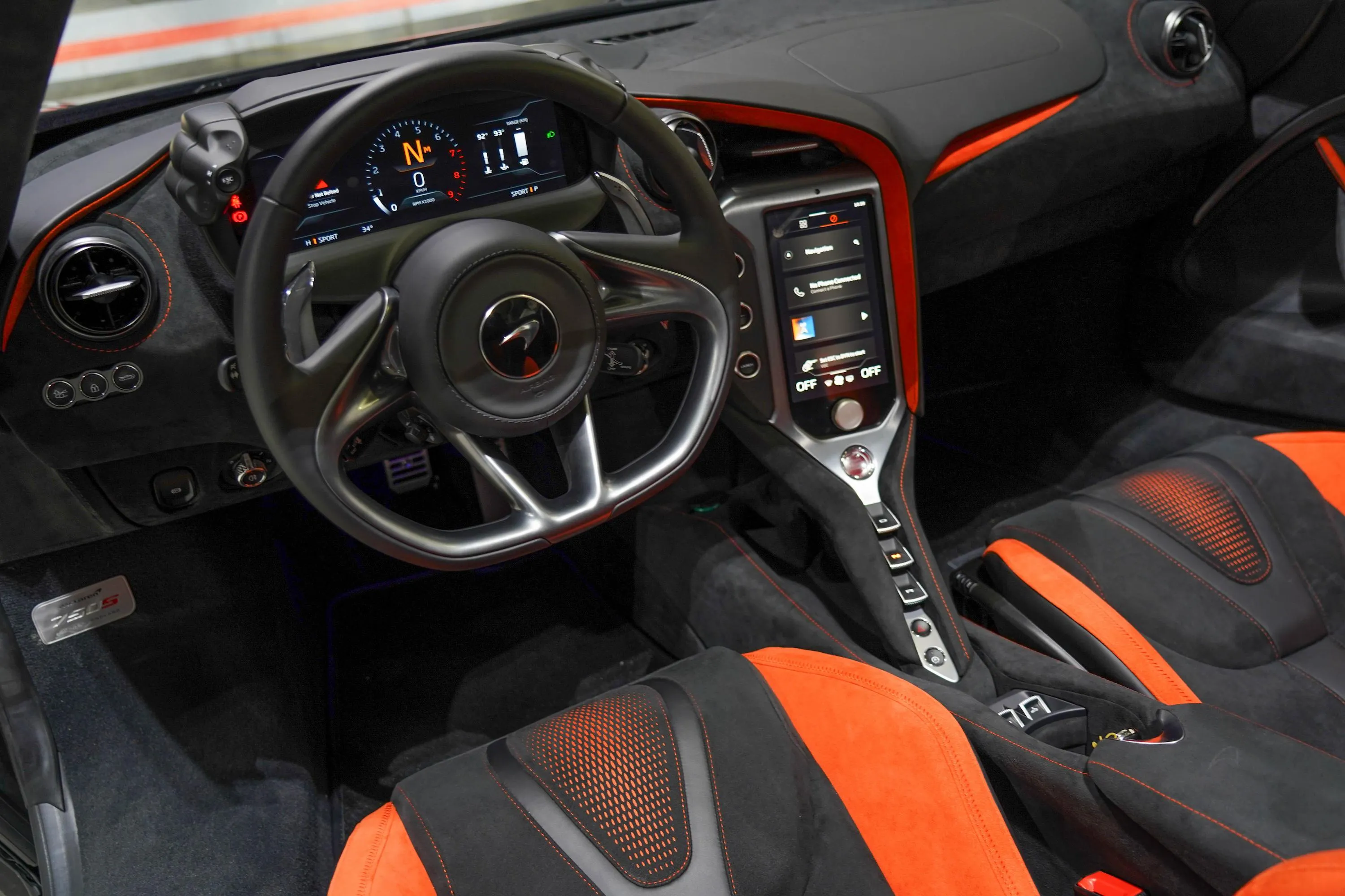 McLaren 750S Spider interior featuring driver-focused cockpit and premium materials at Queen of Supercar Rental.