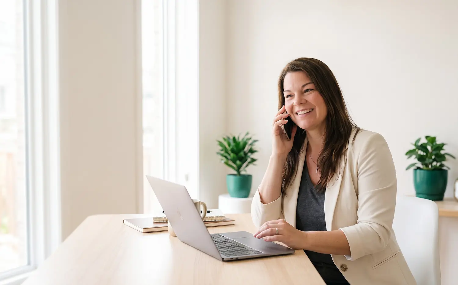 an image of Beth deyo seated at a desk talking on a phone in Bradenton, FL