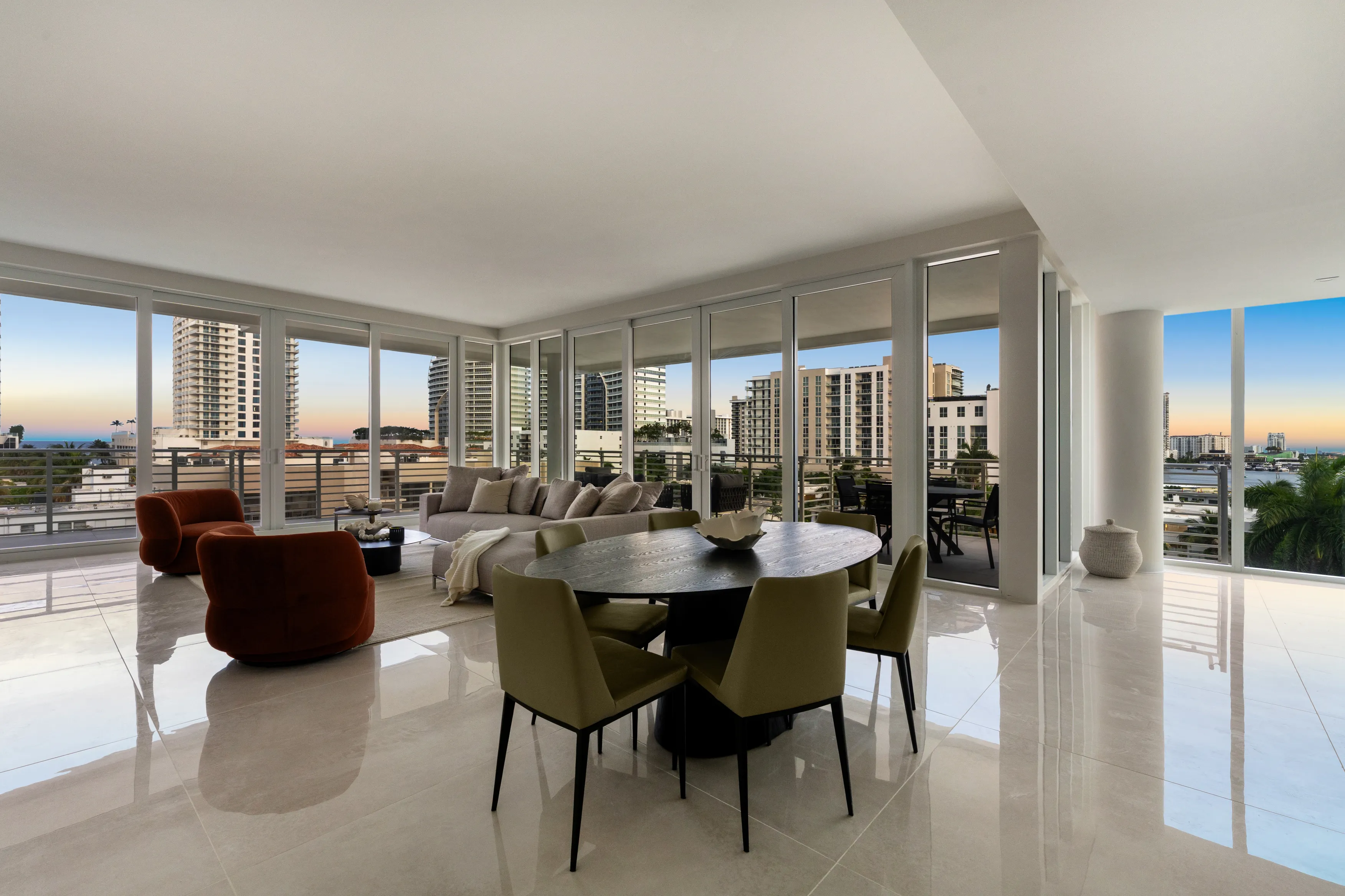 A stylish modern living room with a comfortable seating area and a prominent large television as the focal point.