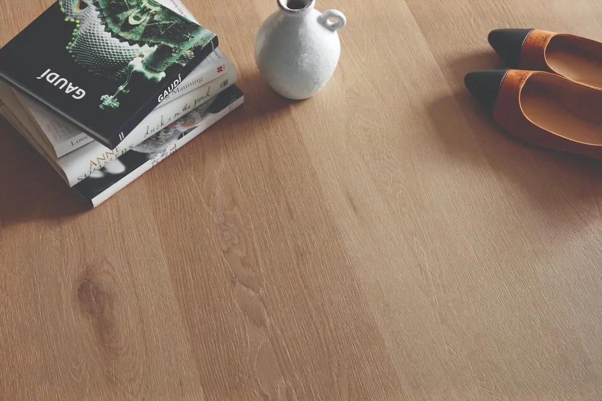 Hybrid timber flooring in a Brisbane home that resists everyday scuffs, stains and moisture, keeping the surface looking calm and lived-in without constant cleaning