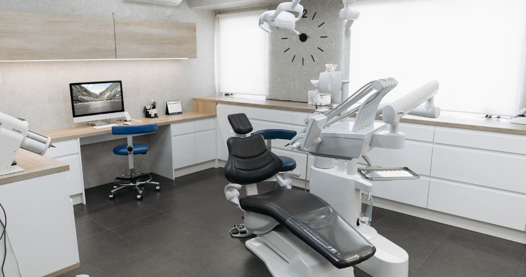 Modern medical aesthetic clinic with treatment chair and desk