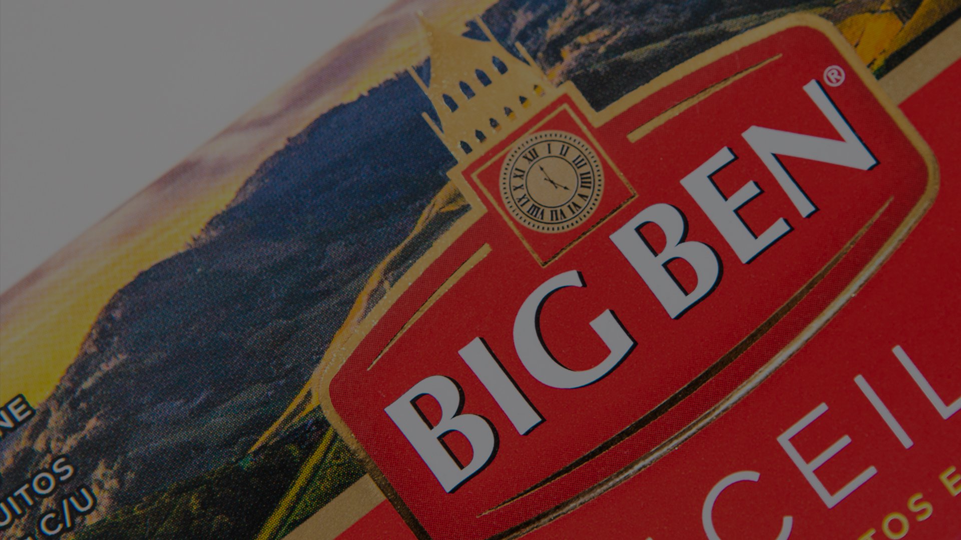 Bold red and gold Big Ben label with clock illustration, evoking time and tradition, set against a backdrop of dramatic, dark mountains.