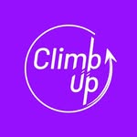 A woman with blonde bob hair in a grey coat and beige turtleneck stands against a neutral backdrop. She has a serious expression, conveying elegance.