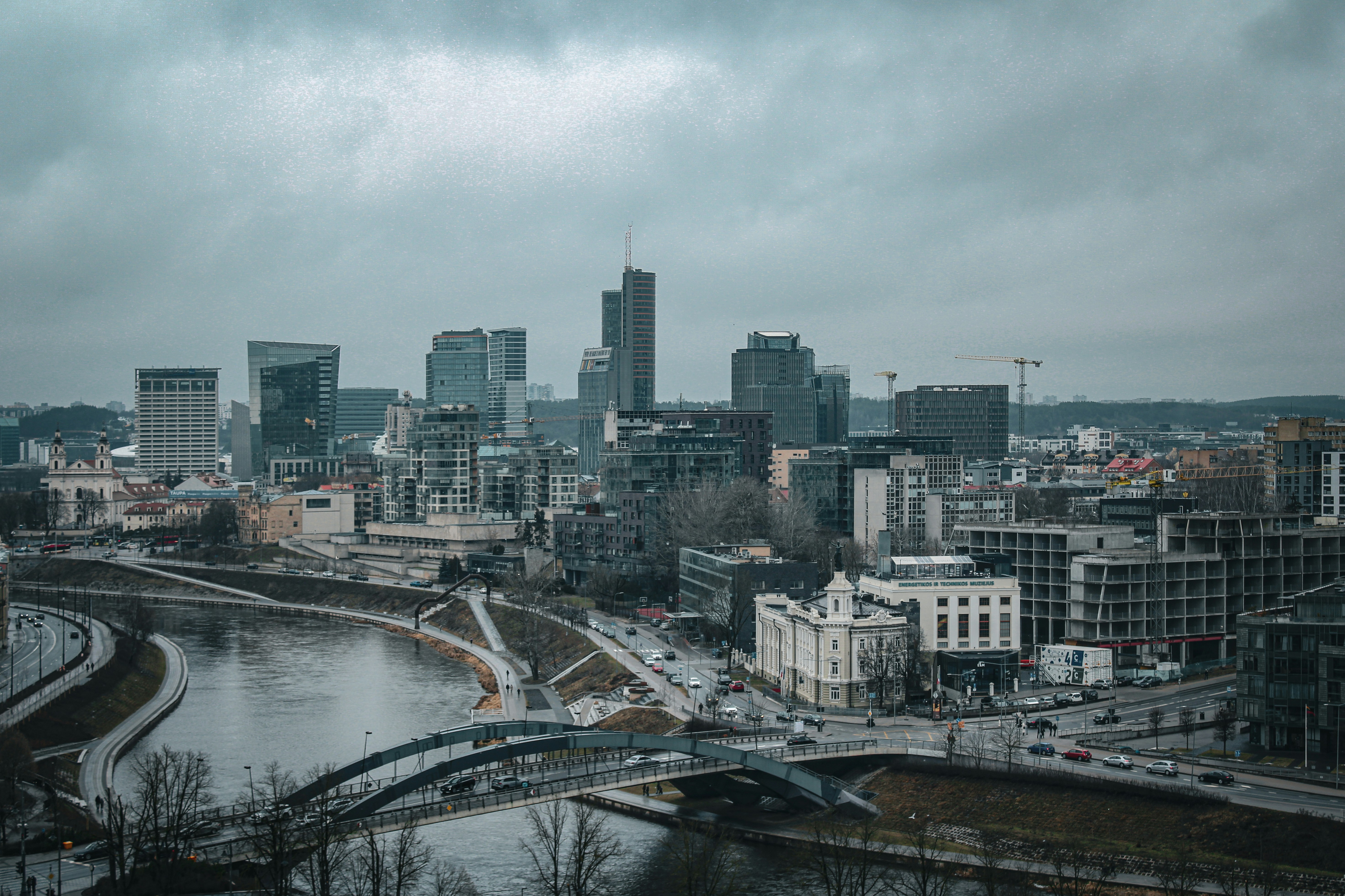 Cityscape view on a cloudy day with river.