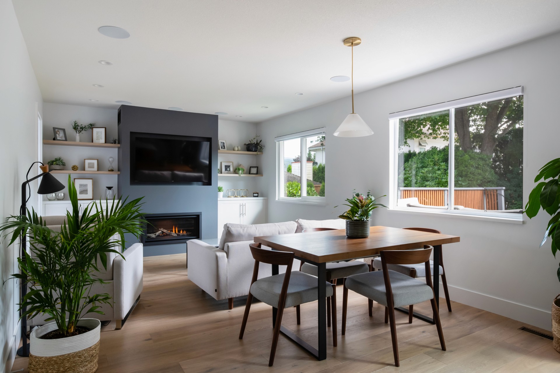 modern mid century designed living room with fireplace and wood accents