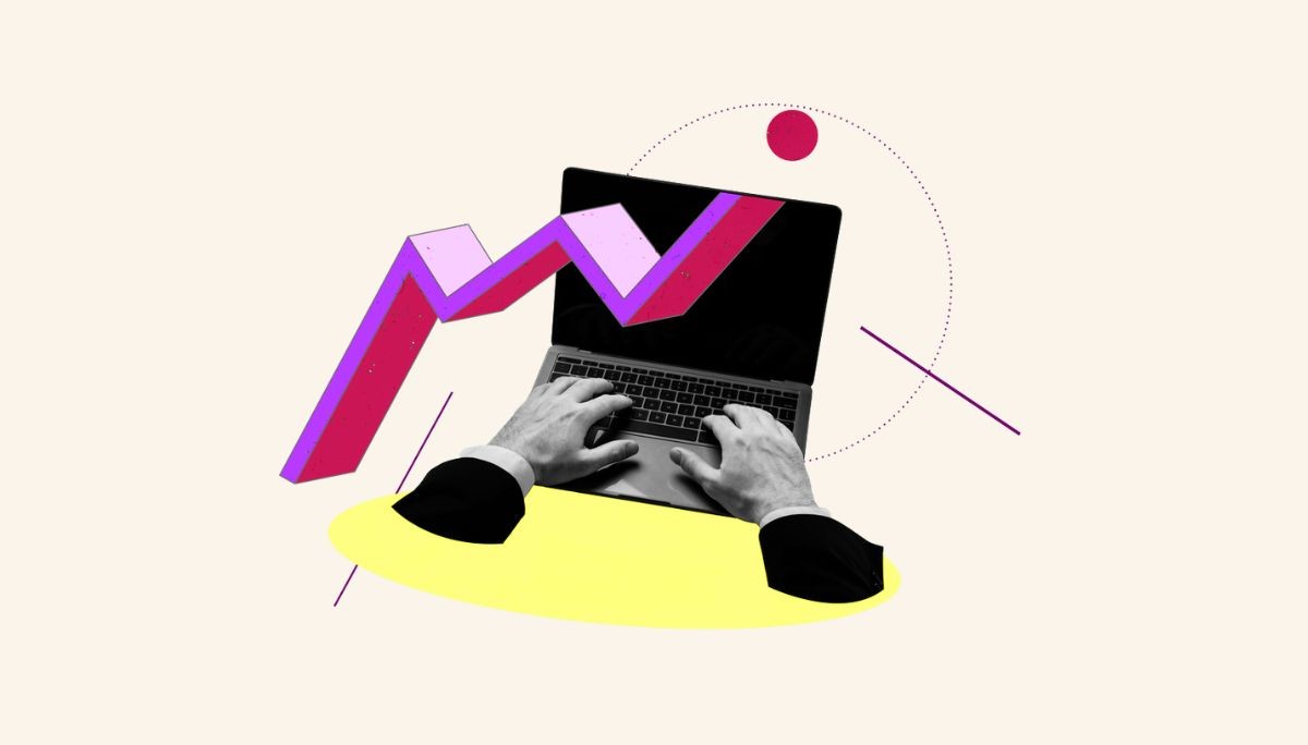 Hands typing on a laptop with abstract rising graph overlay, symbolizing the phases and workflow of the systems development life cycle.
