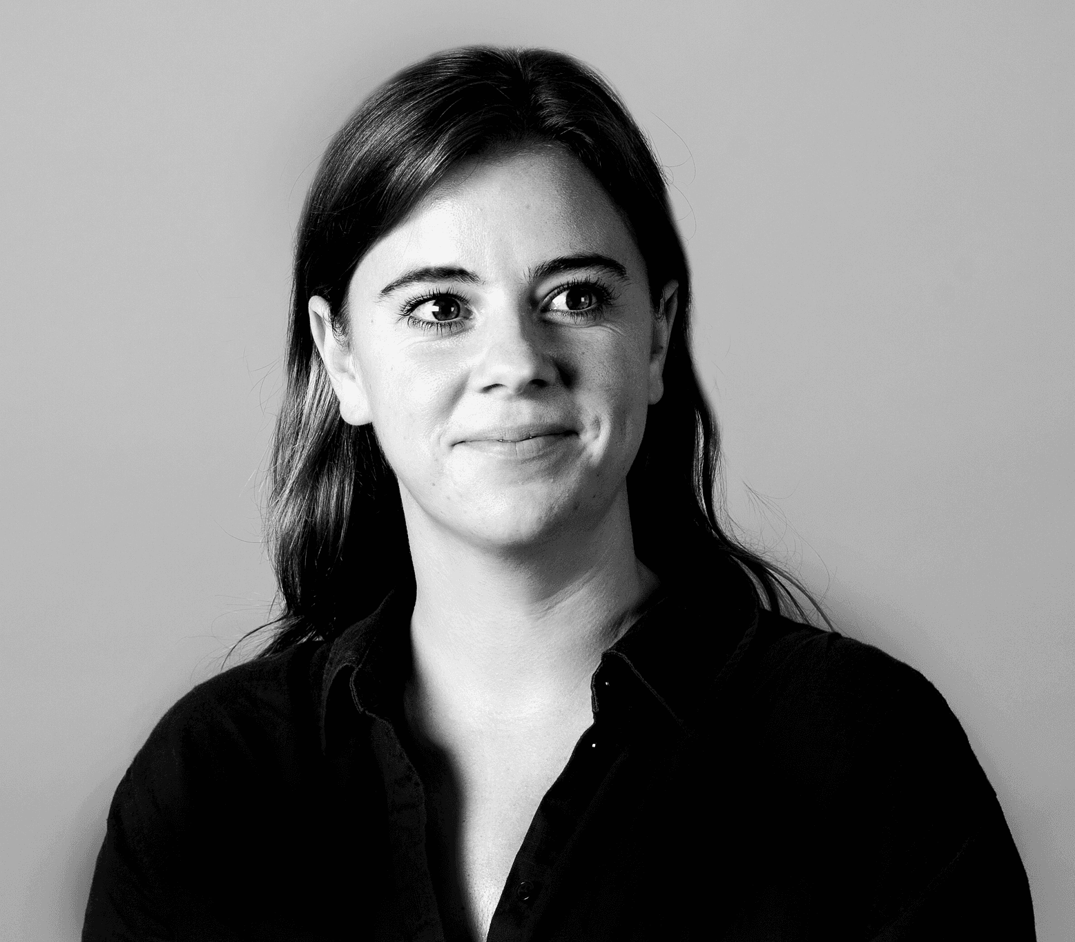 a blurry photo of a person standing in front of a wall