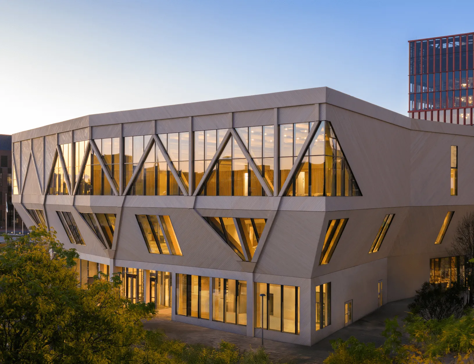 Exterior building view of timber construction with a glow from interior illumination