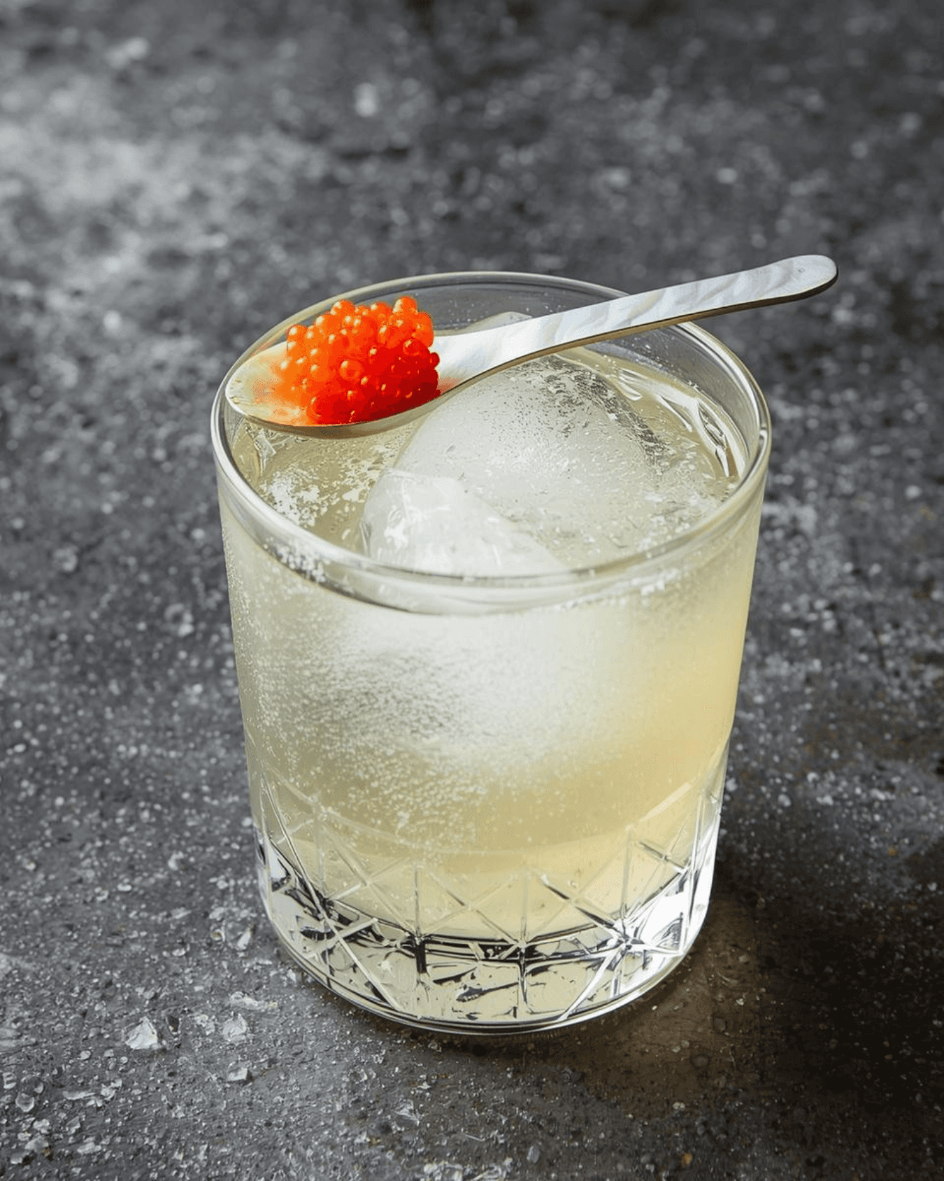 sliced yellow citrus fruit next to cocktail glass