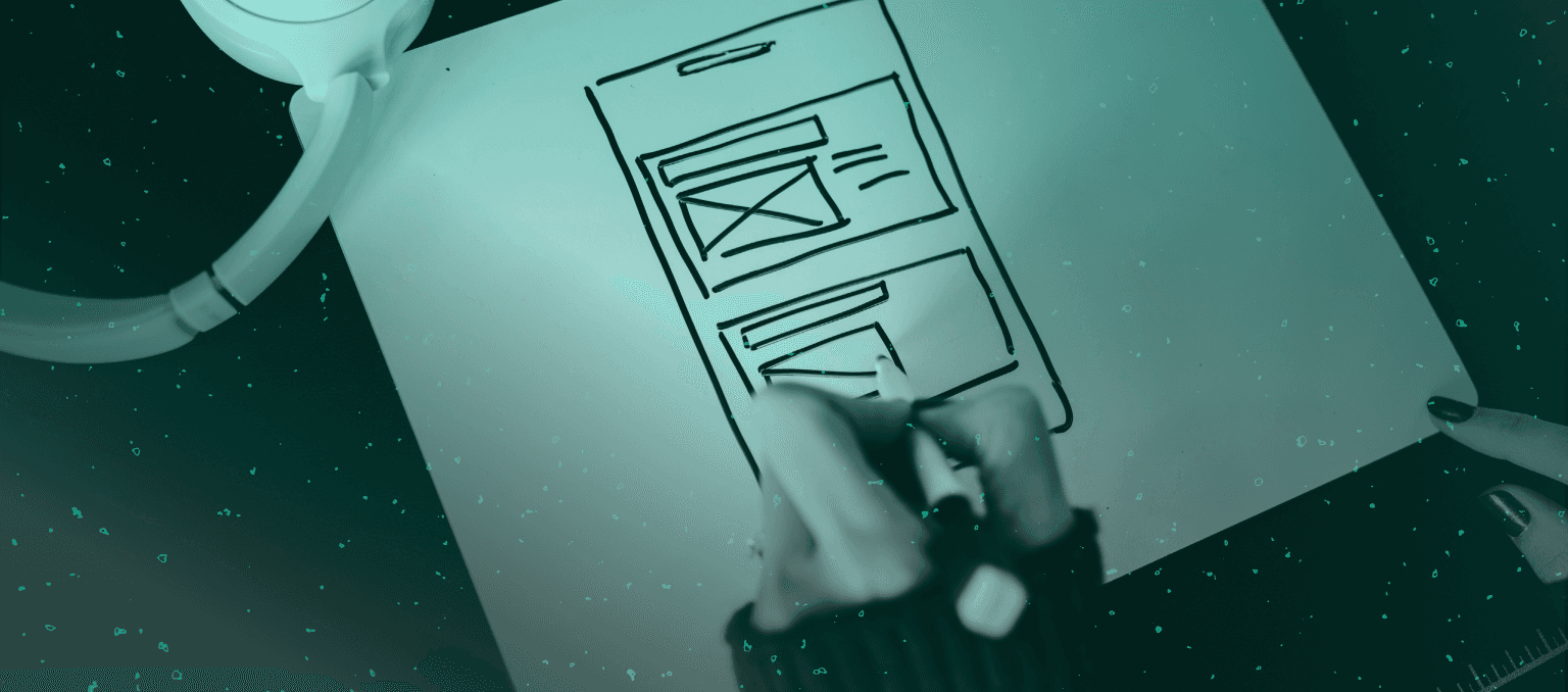 Designer sketching a wireframe layout for an email campaign, illustrating the structure and visual hierarchy behind high-converting email design.