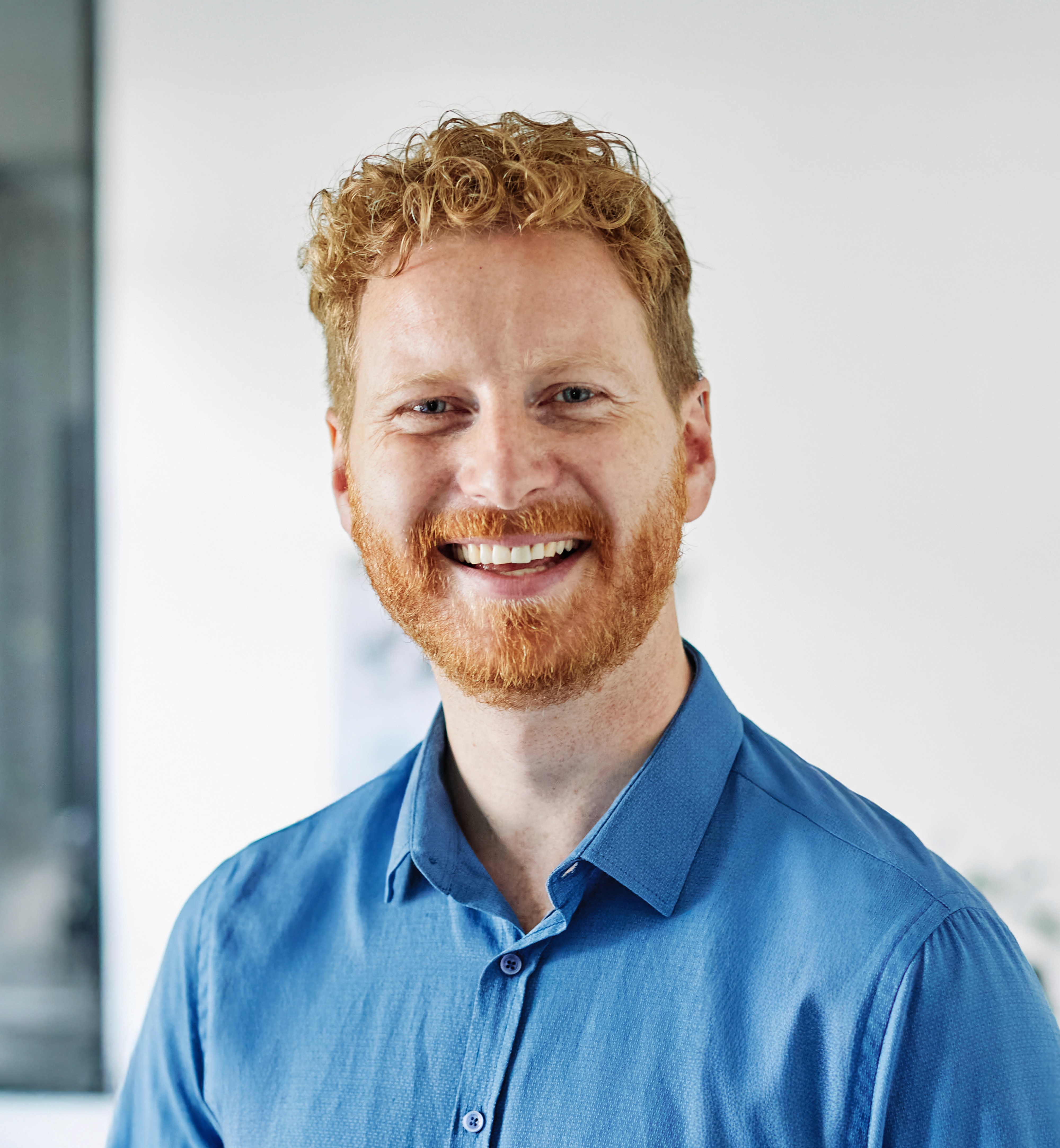 The image features a close-up portrait of a person with an intense gaze directed toward the camera.
