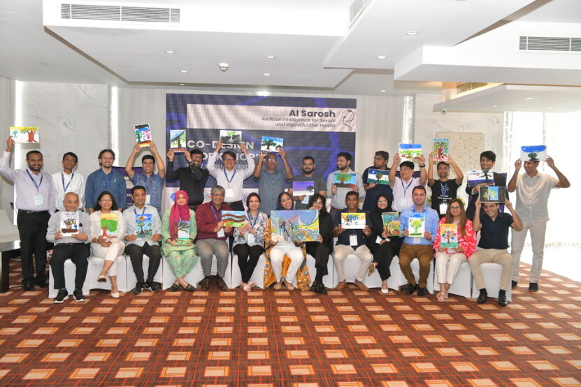 The team behind the AI Sarosh project holding up their artworks while standing on a podium