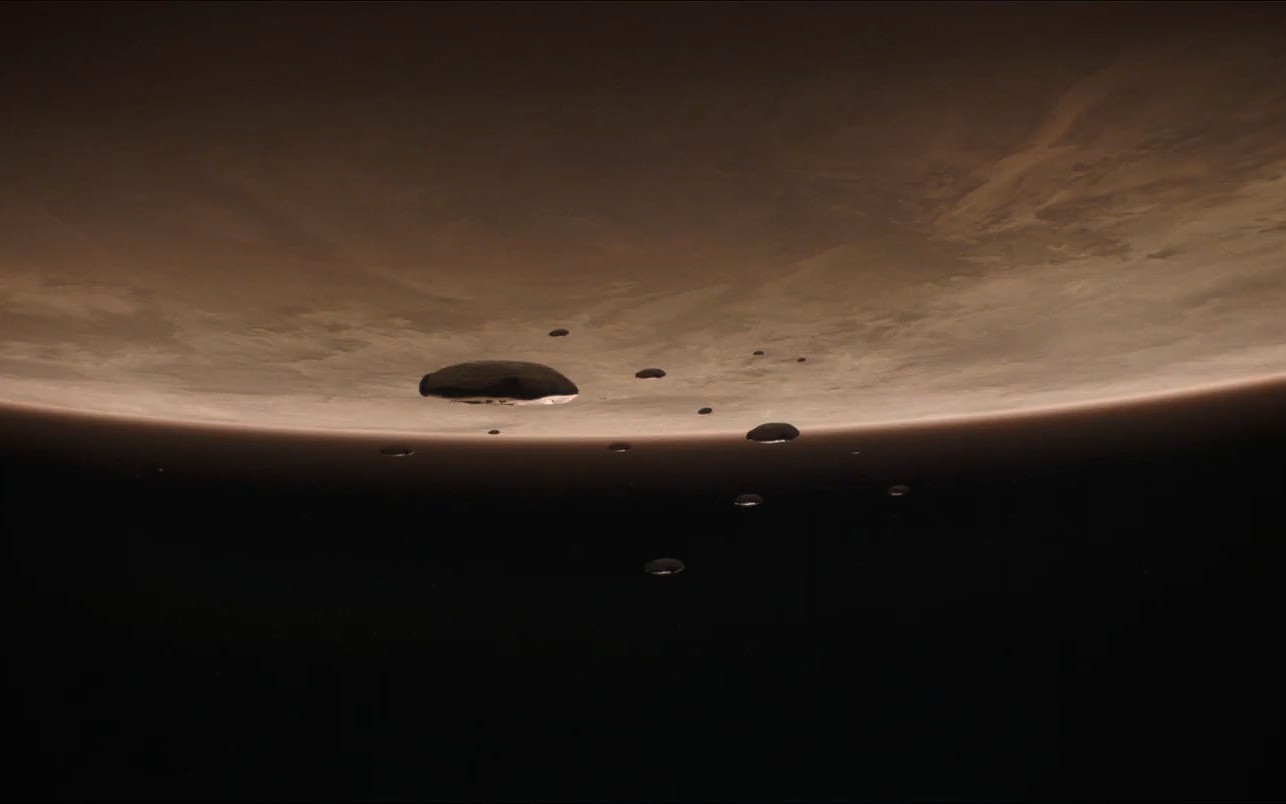 Dune movie still showing a planet with spaceships