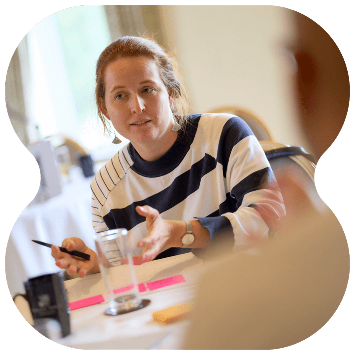 Photo of an Opencast team member conversing and sharing opinion during a brainstorming session