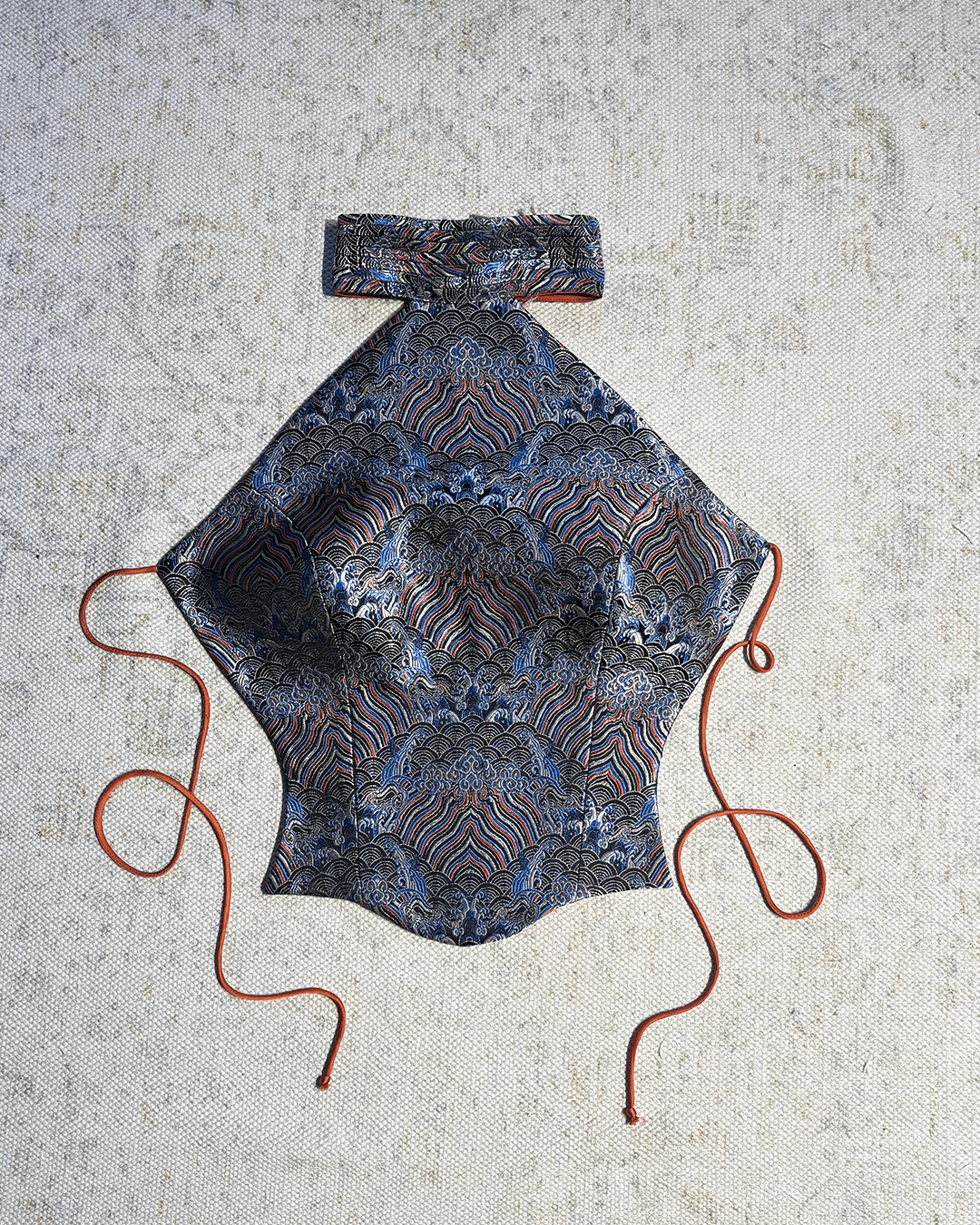 APSARA VI is our high-neck, backless top crafted from a vintage silk saree, inhouse by skilled artisans. 