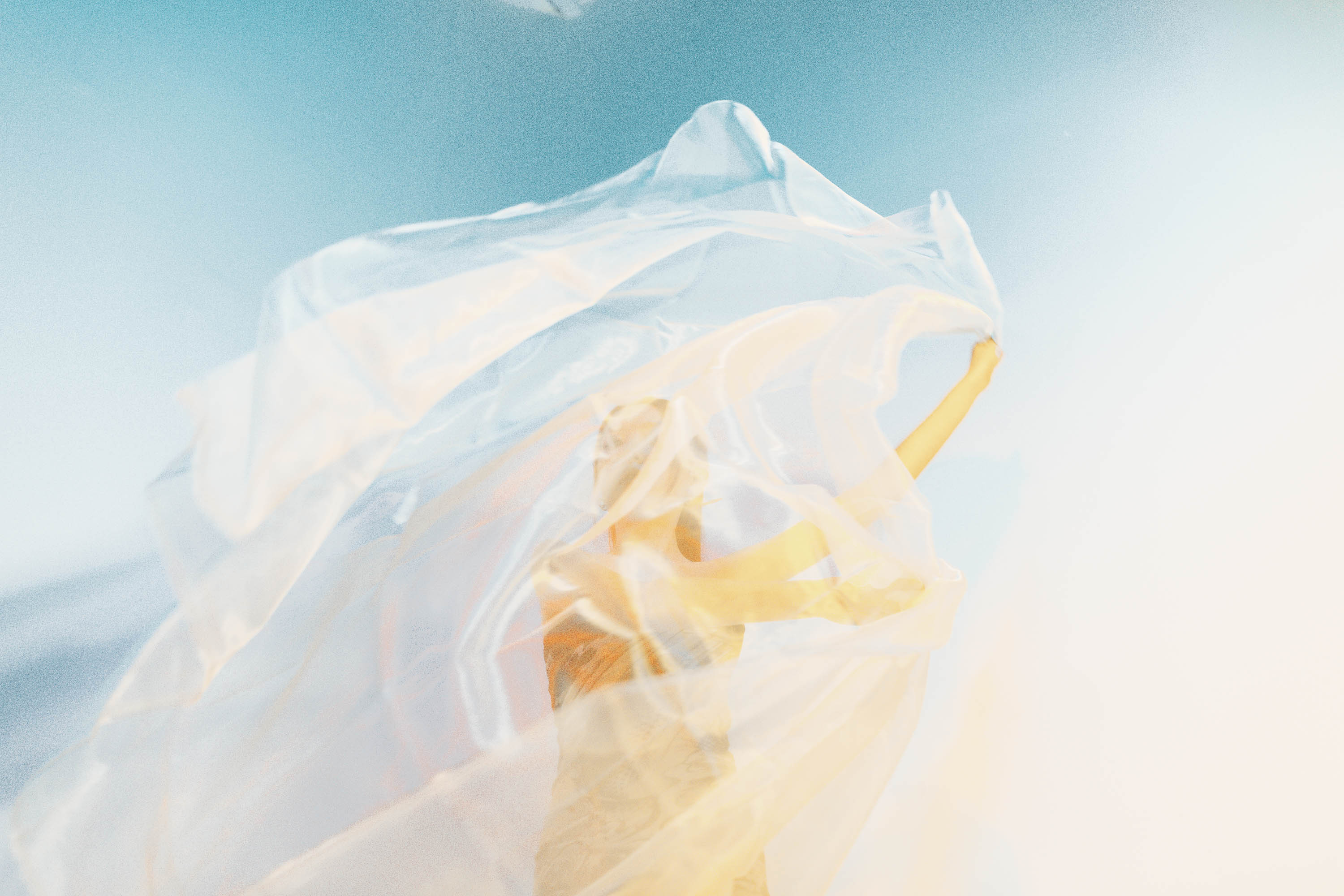 Dark portrait of a woman next to a swimming pool