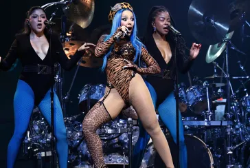 Doja Cat performing in animal print bodysuit.